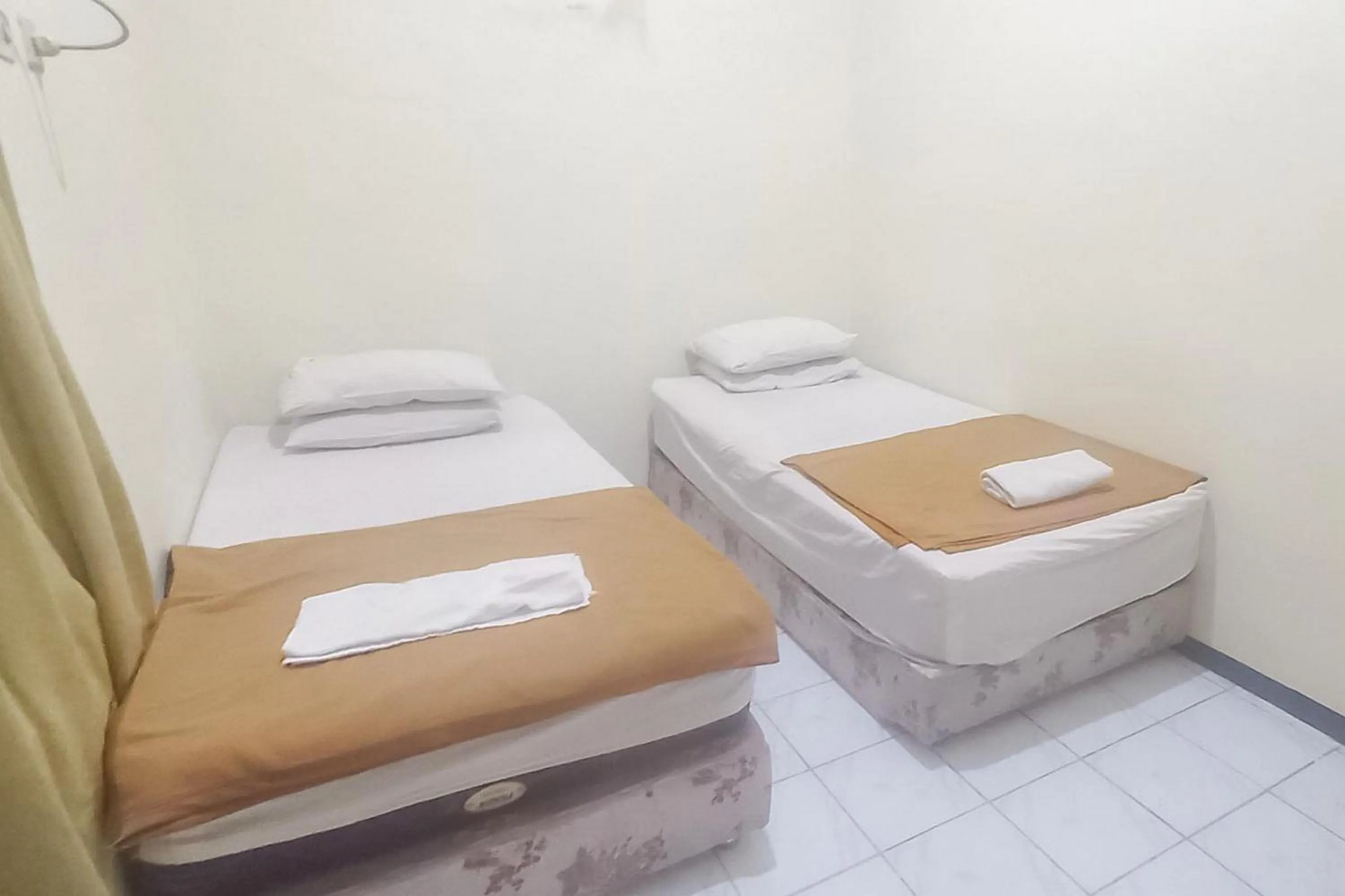 Bed in Hotel Malang near Alun Alun Malang RedPartner