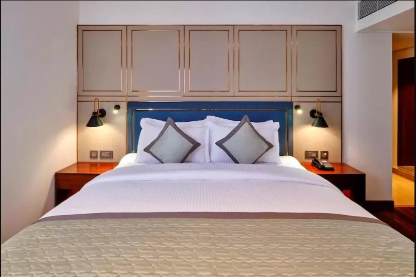 Bed in Pride Hotel Udaipur