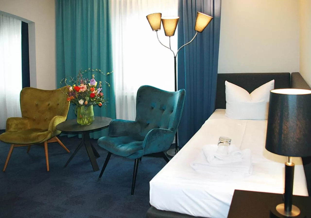 Photo of the whole room, Seating Area in AVIA Hotel