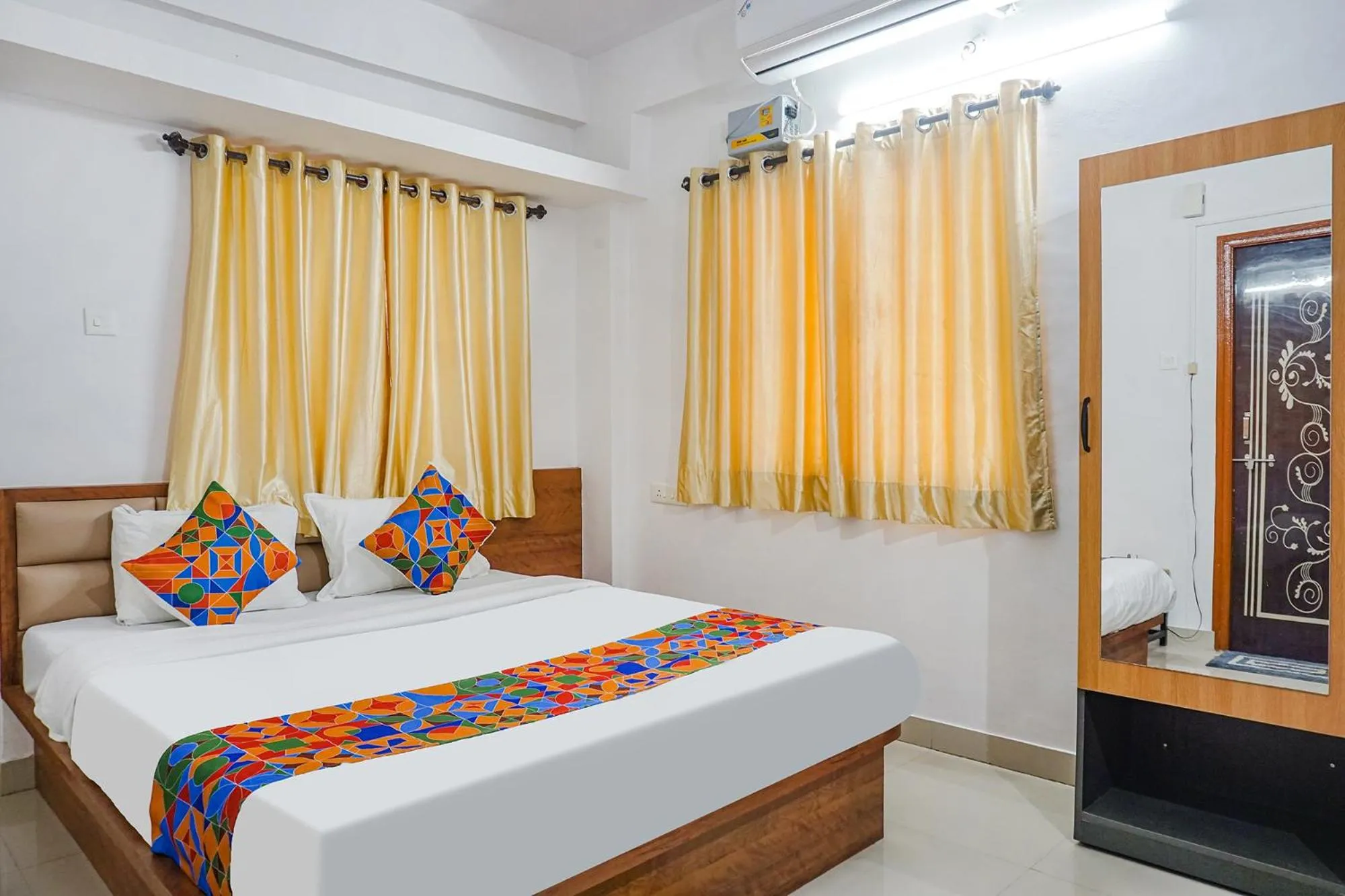 Bed in FabHotel Lake View - Chinmaya Vitthal Mandir