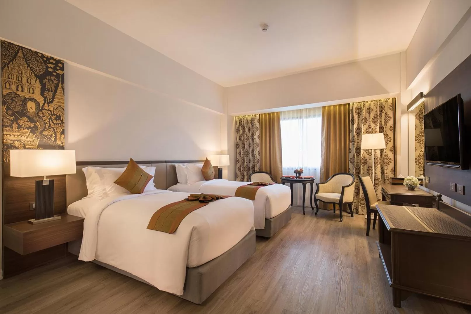 Bed in The Heritage Chiang Rai Hotel and Convention