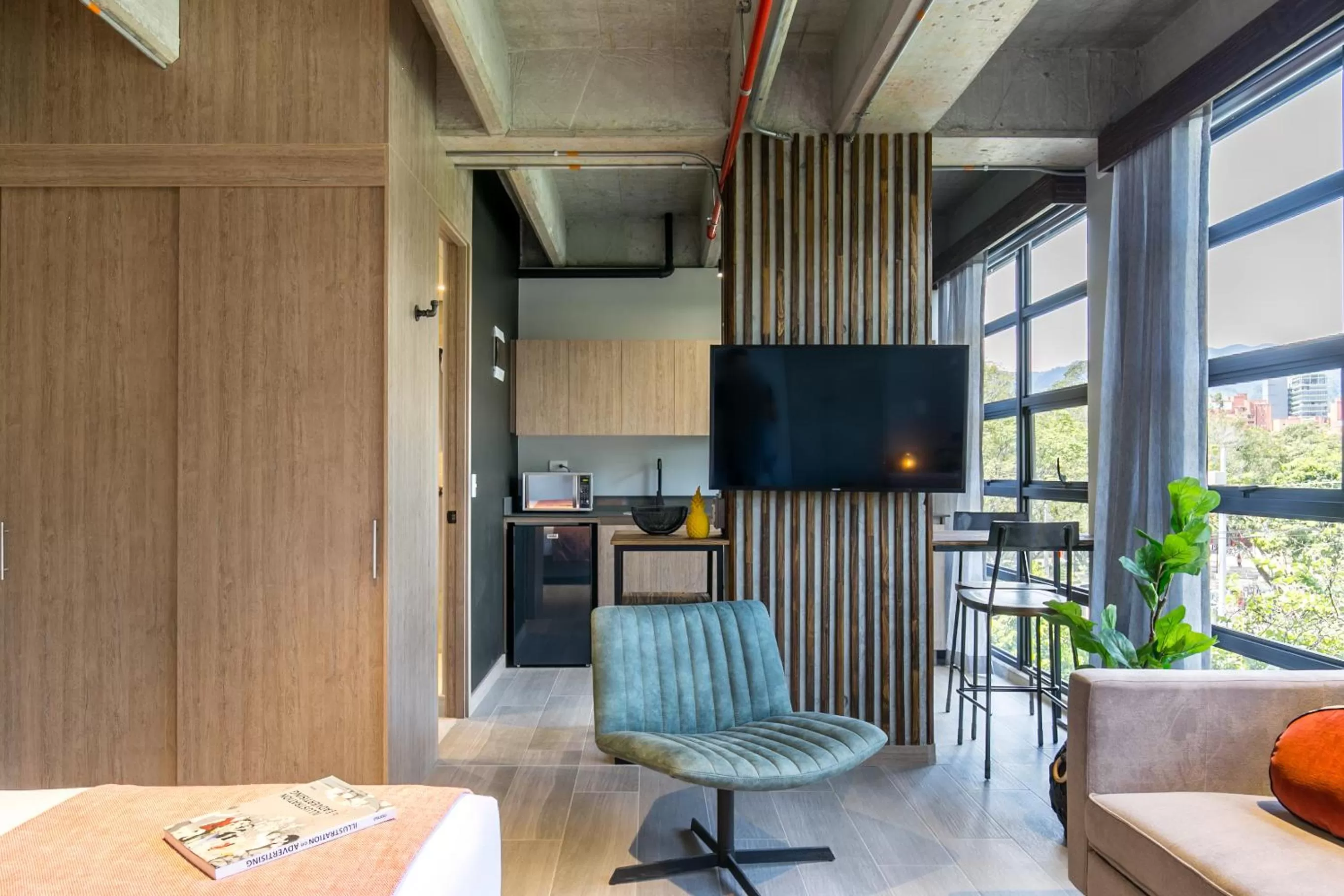 Communal lounge/ TV room in Factory Lofts Hotel