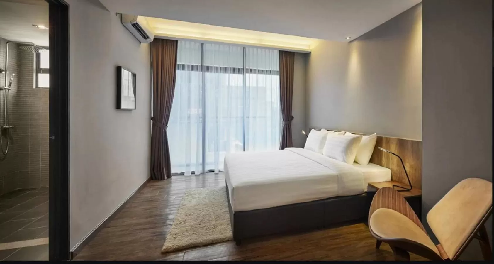 Bed in Tropics Eight Suites