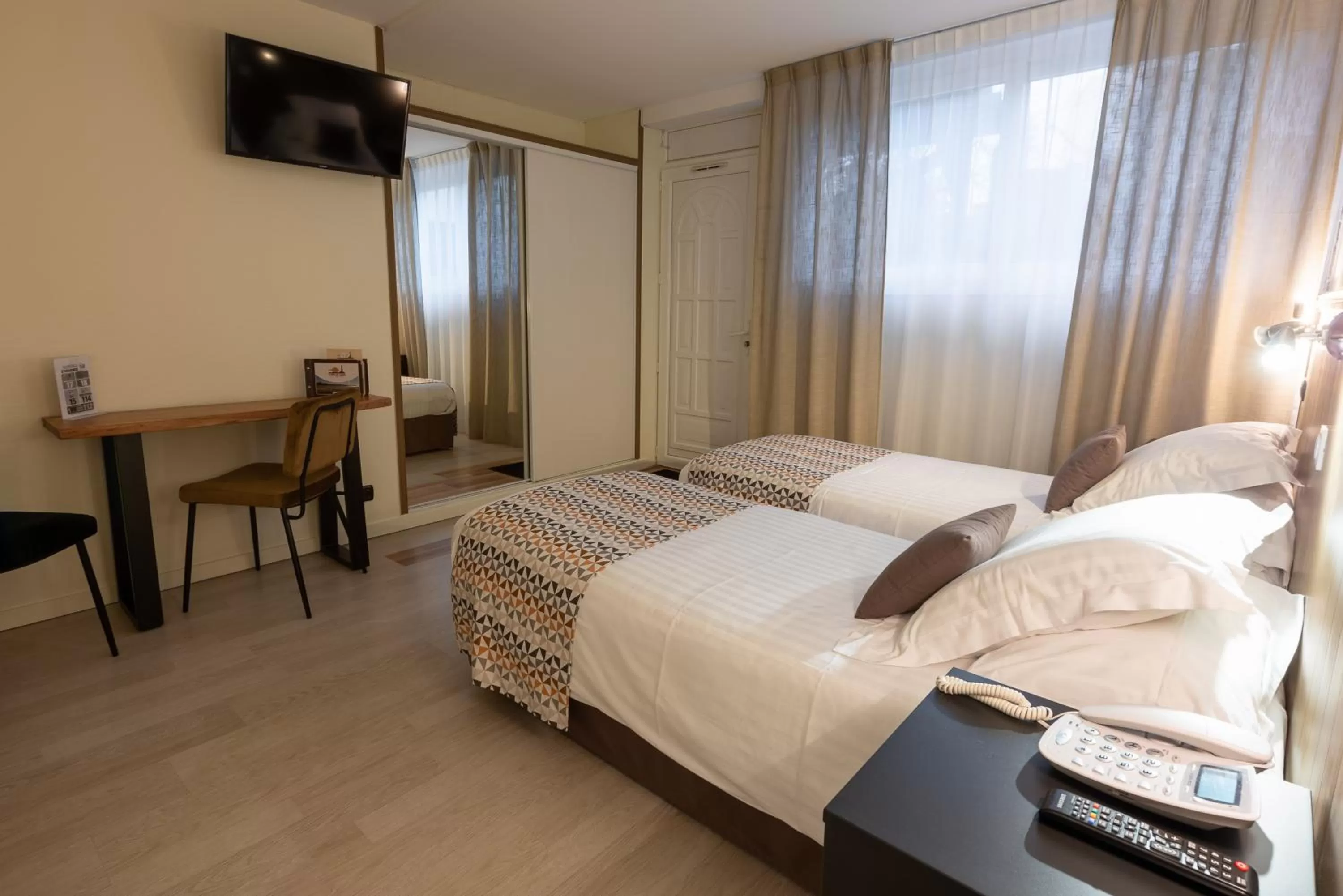 Bed in Logis Hôtel Rêve de Sable