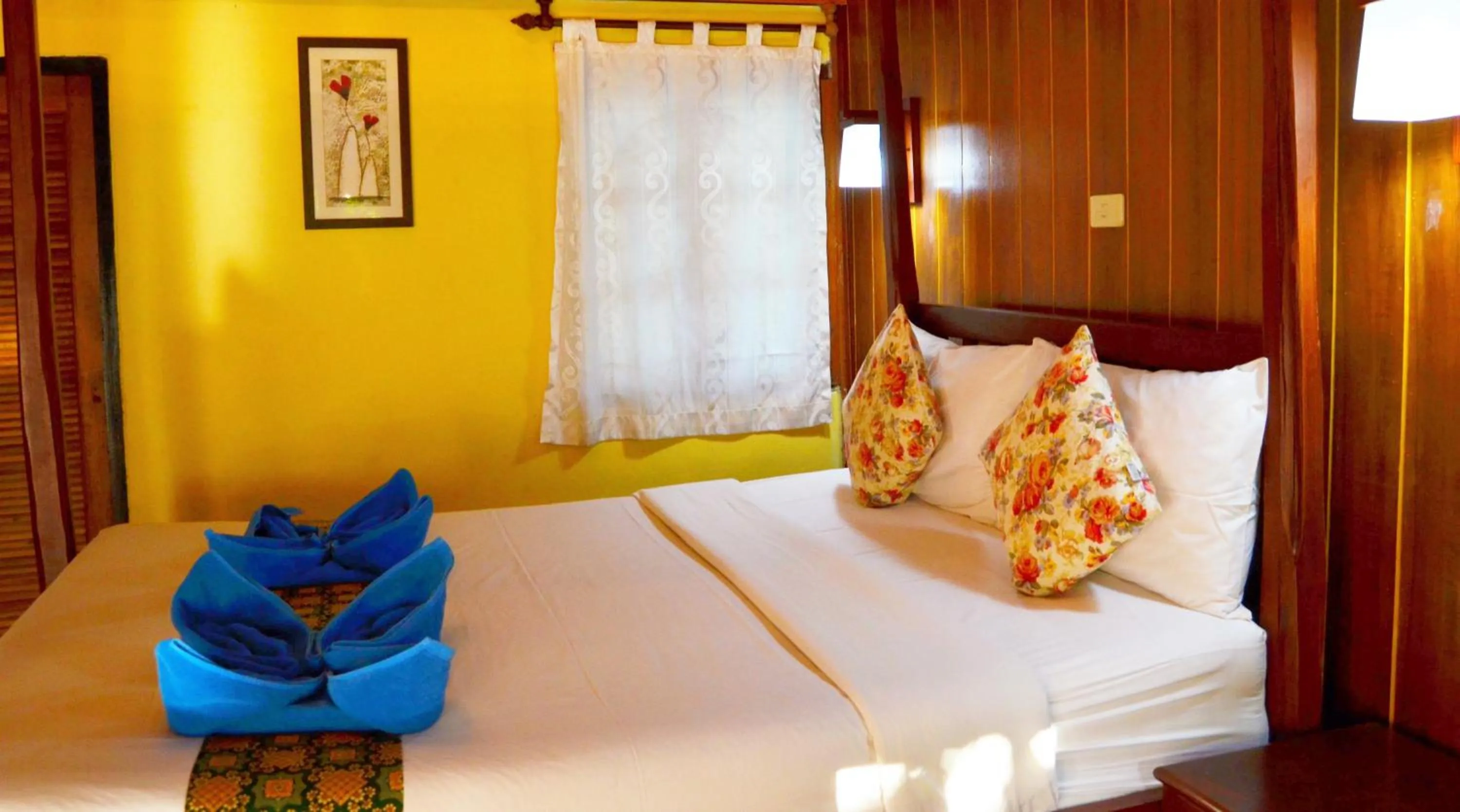 Bed in Sayang Beach Resort Koh Lanta