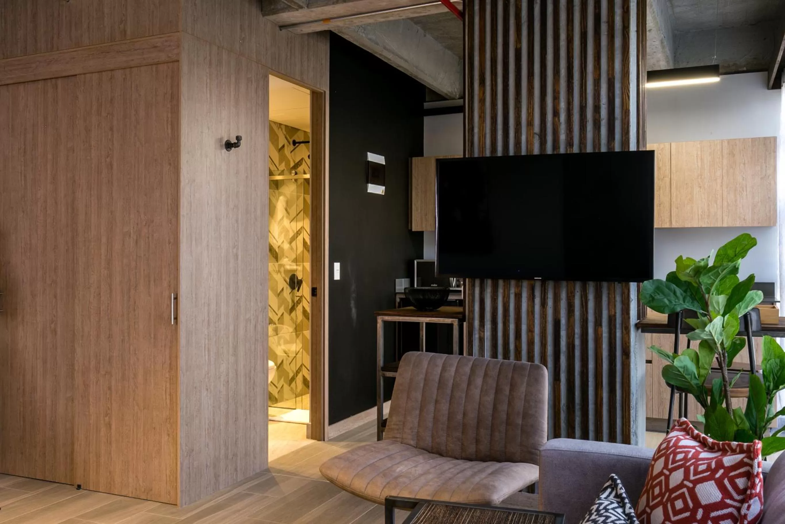 Communal lounge/ TV room in Factory Lofts Hotel