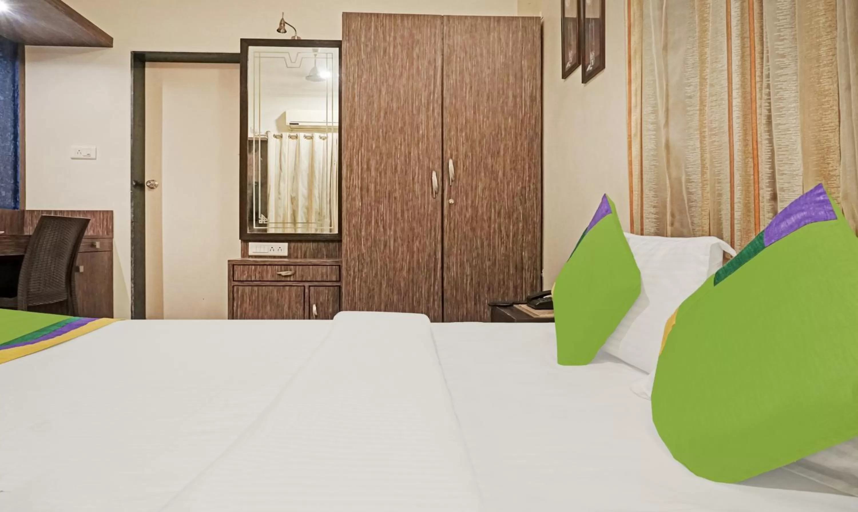 Bedroom, Bed in Treebo Excellent Home