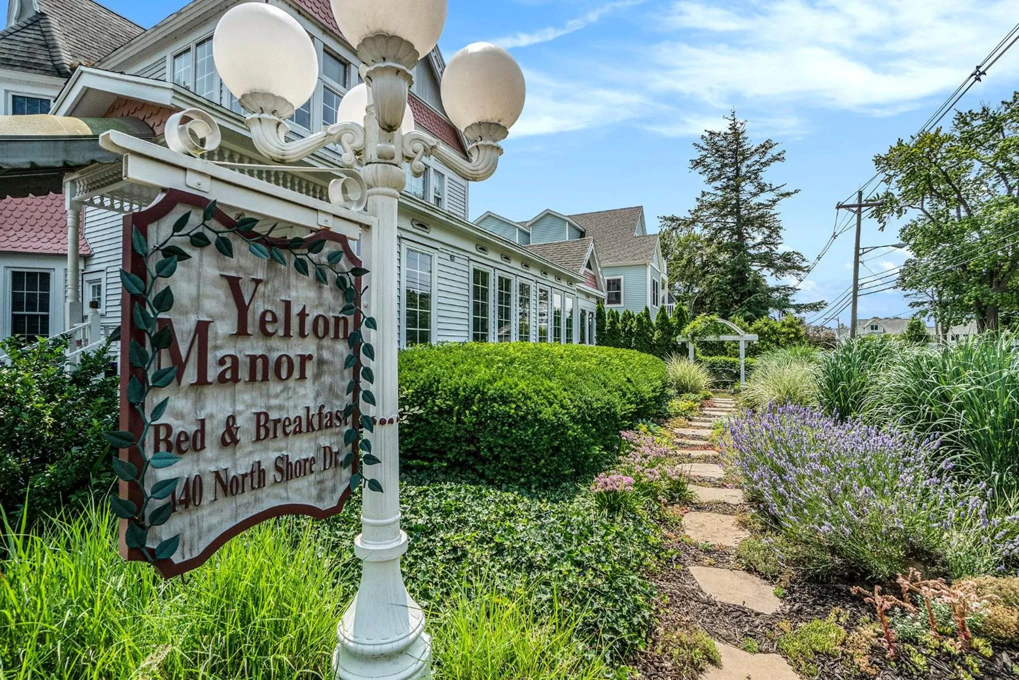 Property logo or sign in Yelton Manor Bed and Breakfast