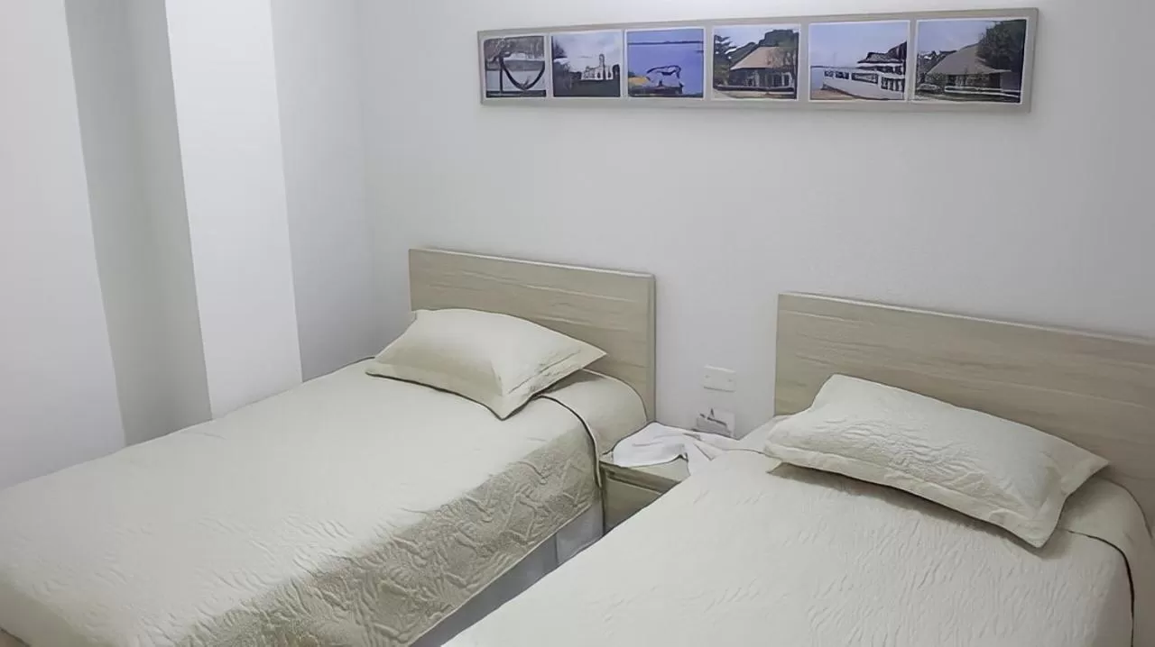 Bed in Hotel Iraka Zenu