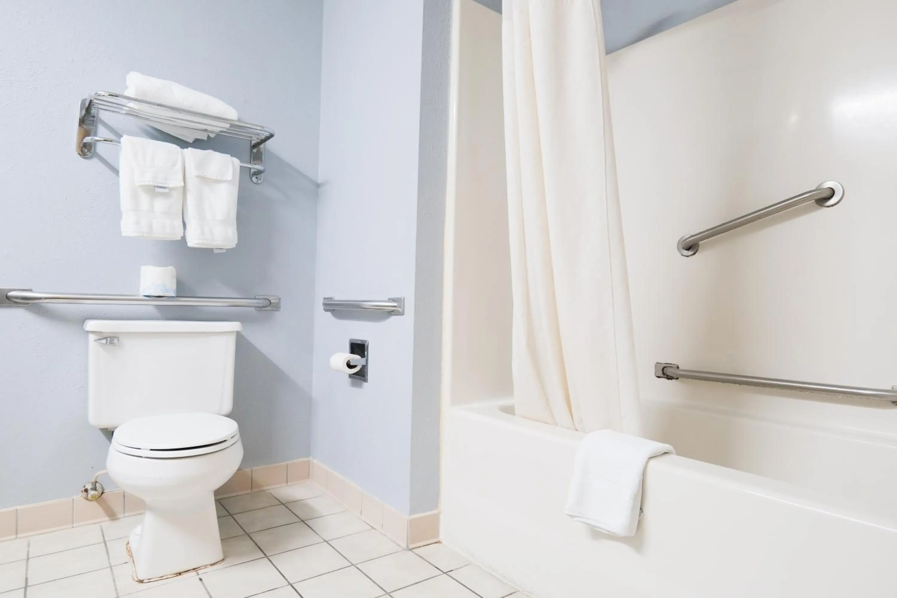 Toilet in Baymont by Wyndham Flint Airport North