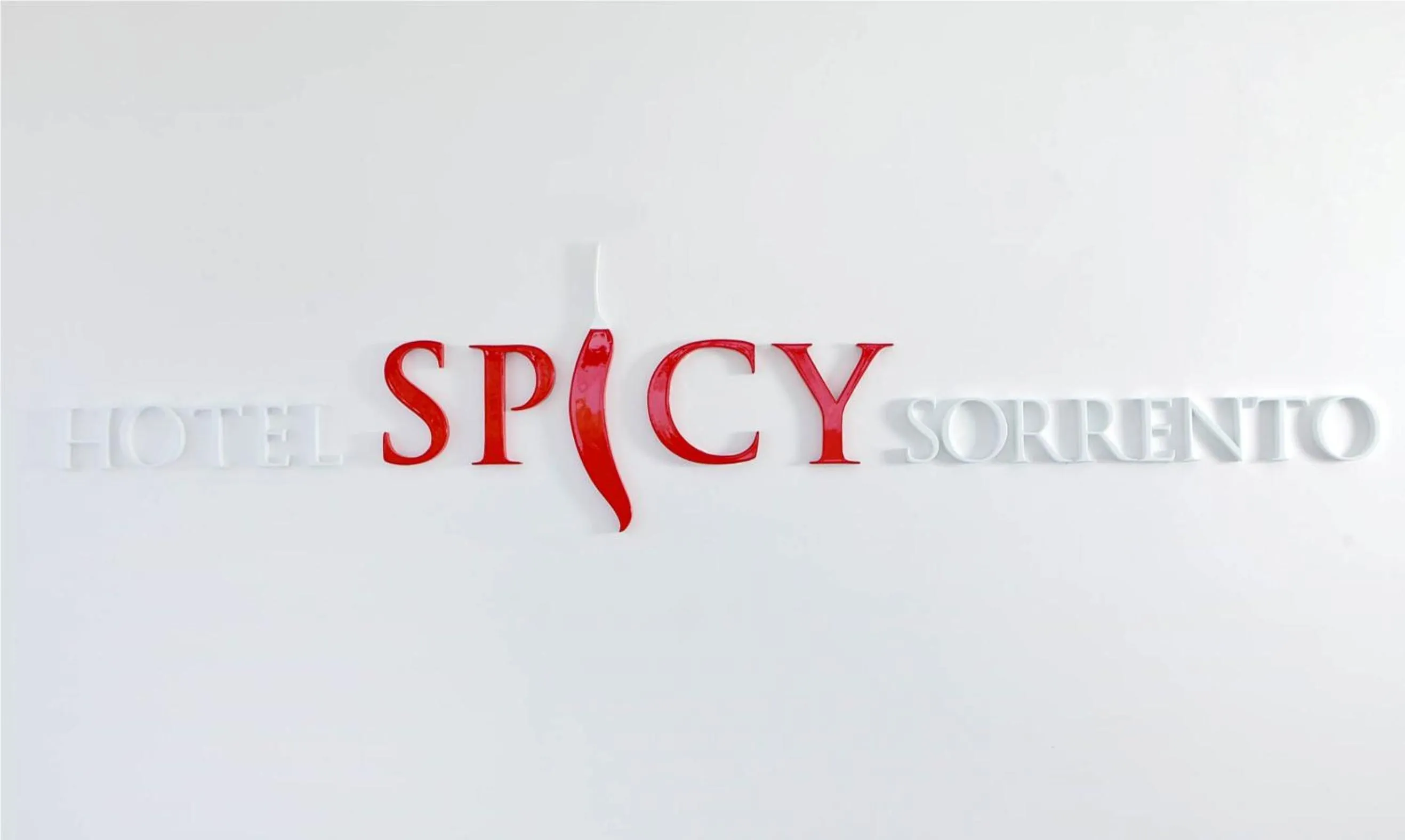Property logo or sign in Hotel Spicy