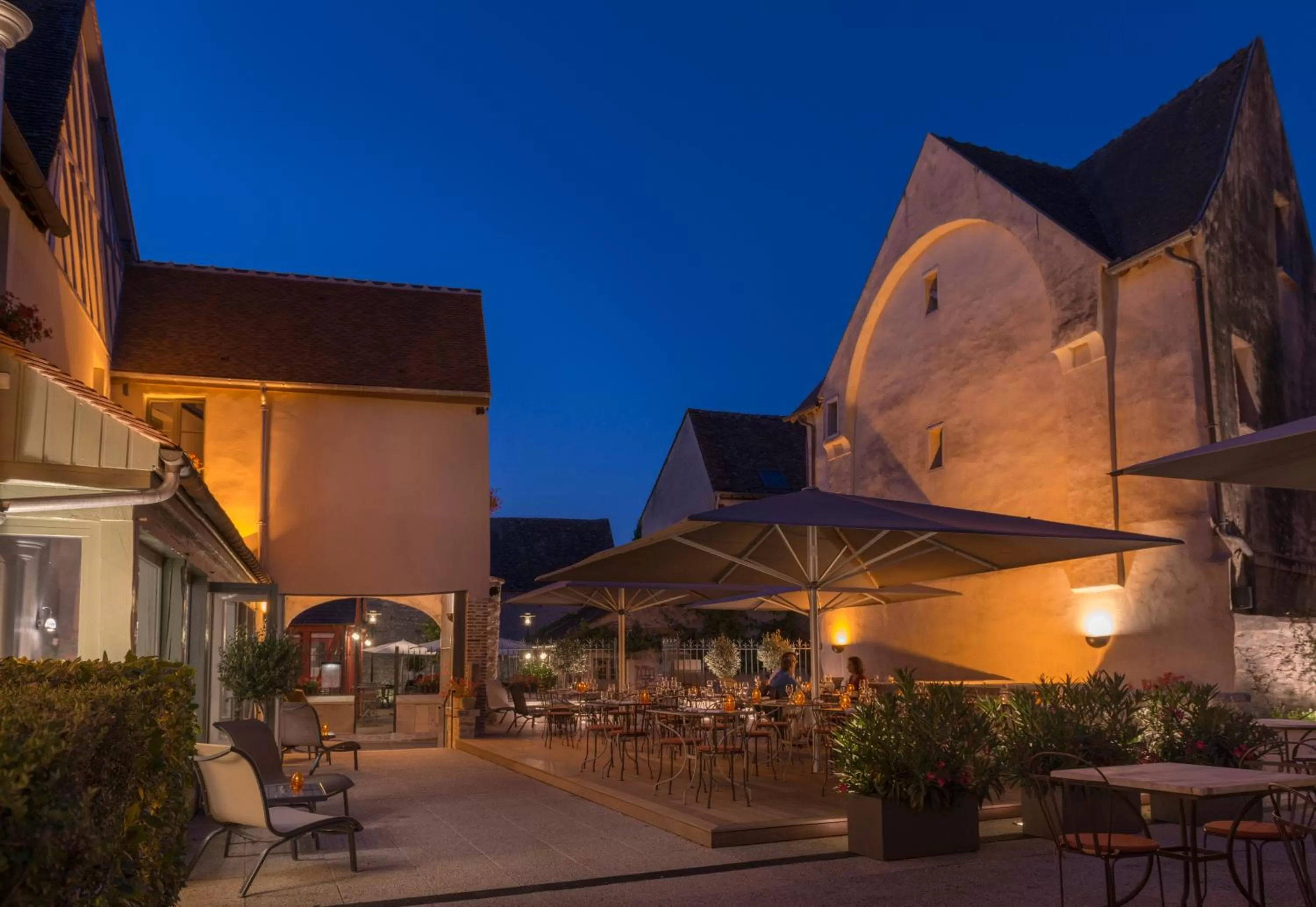 Patio in Hôtel Aux Vieux Remparts, The Originals Relais