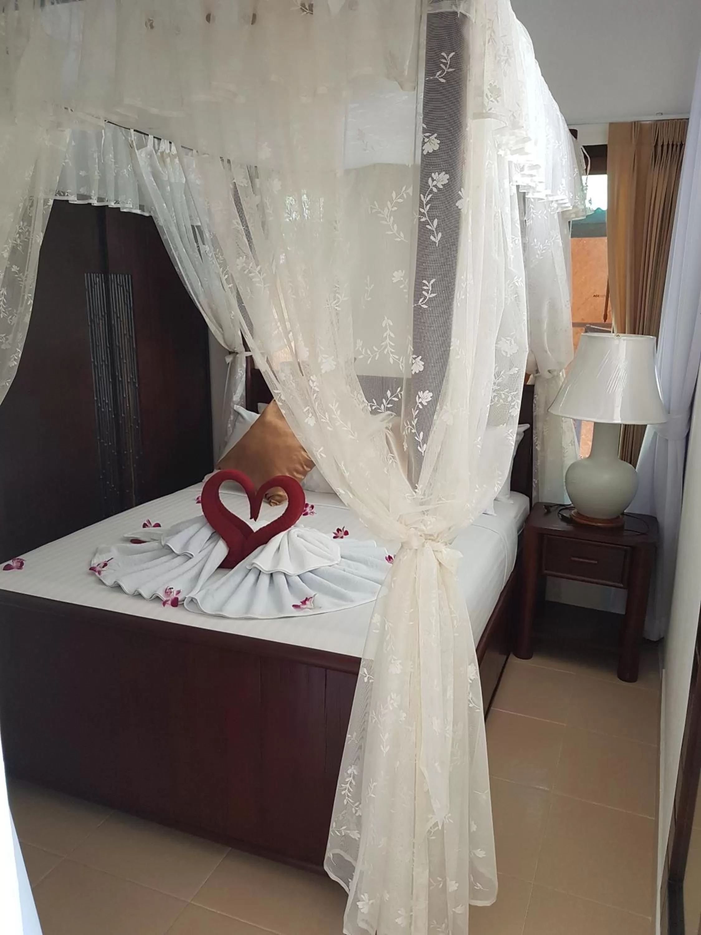 Bed in Jungle Village Bungalow