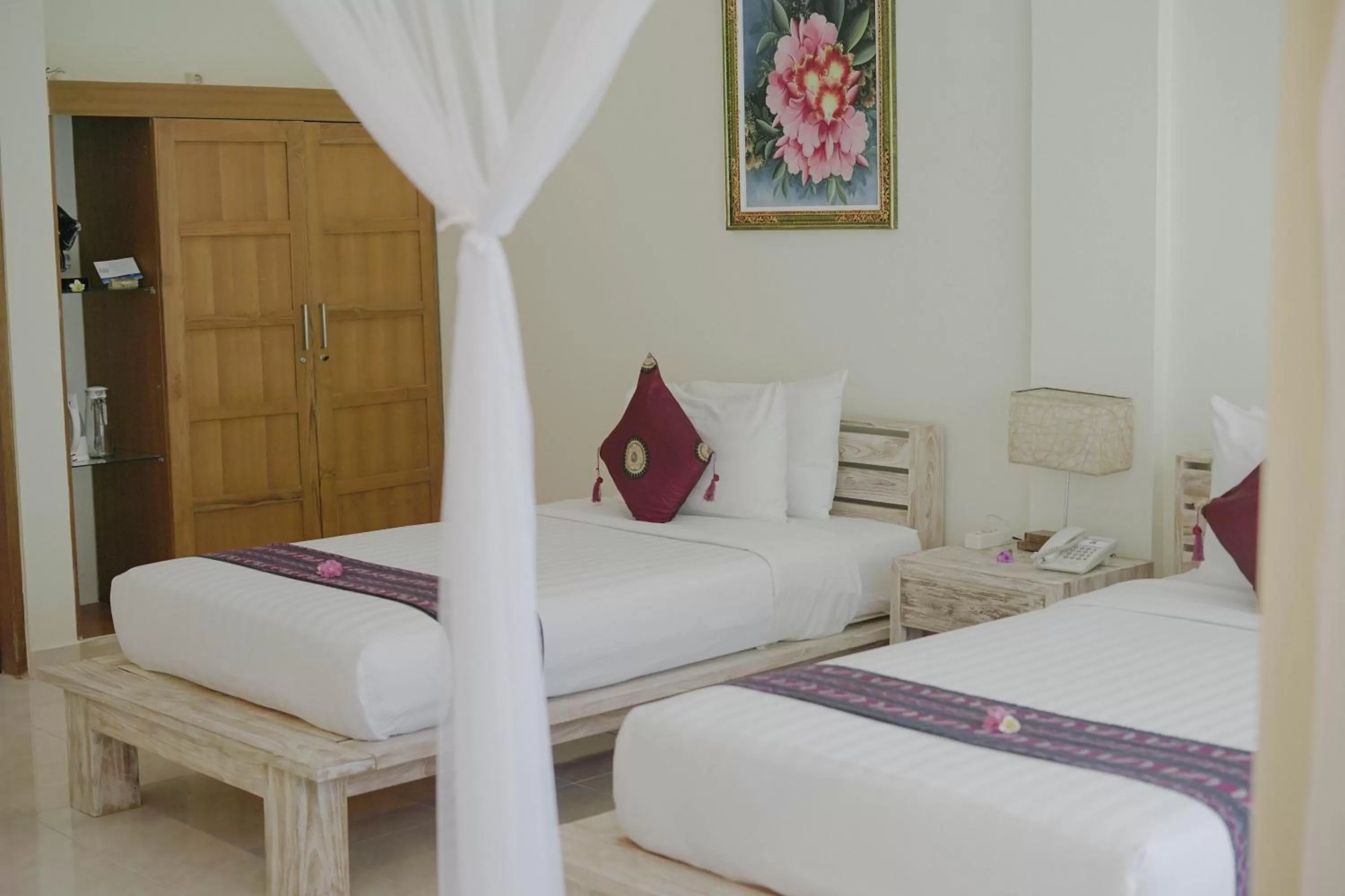 Bed in Puri Sari Beach Hotel