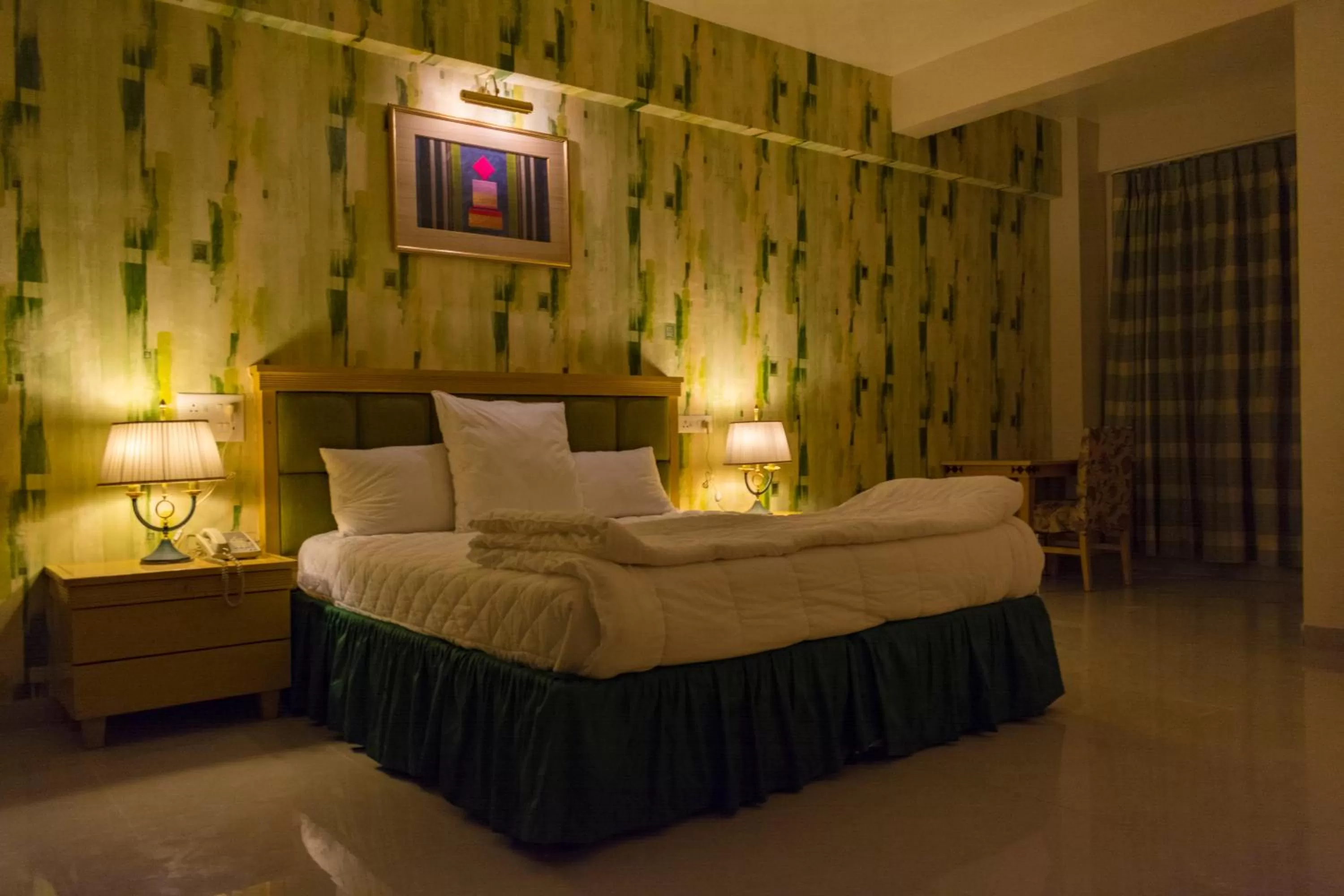 Bed in Mango Valley Resort Ganpatipule