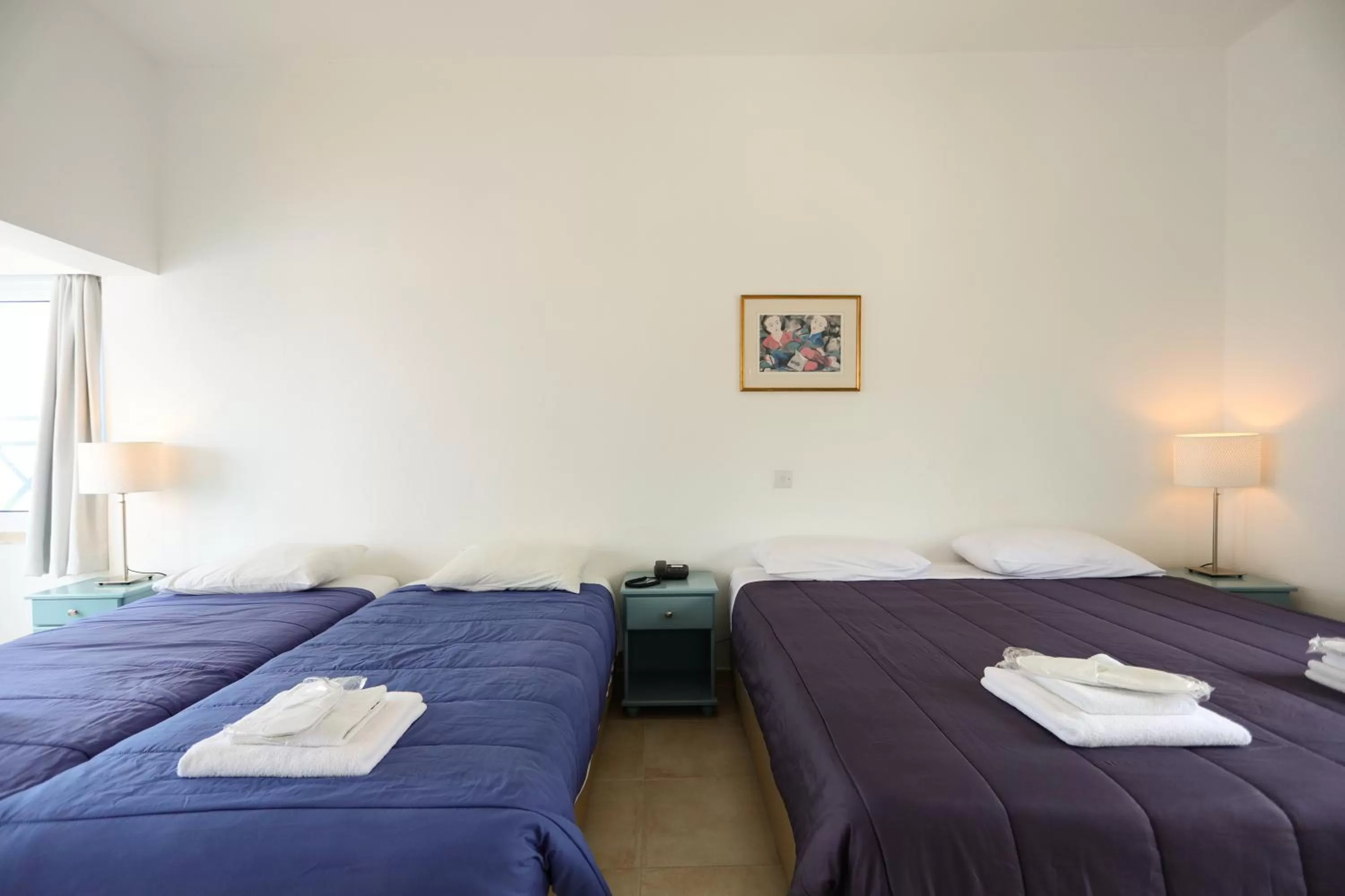 Bed in Axiothea Hotel