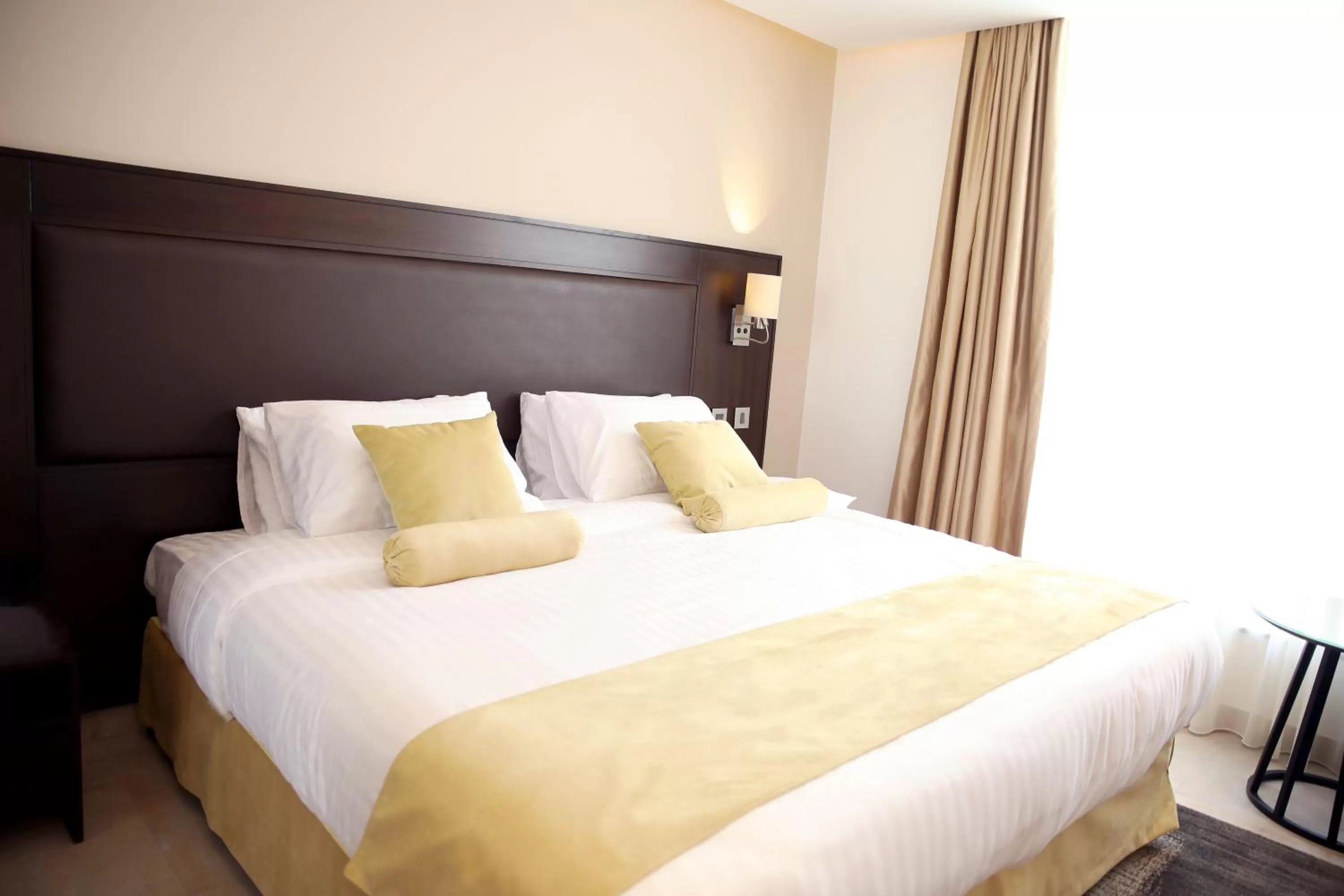 Bed in Downtown Hotel Apartments