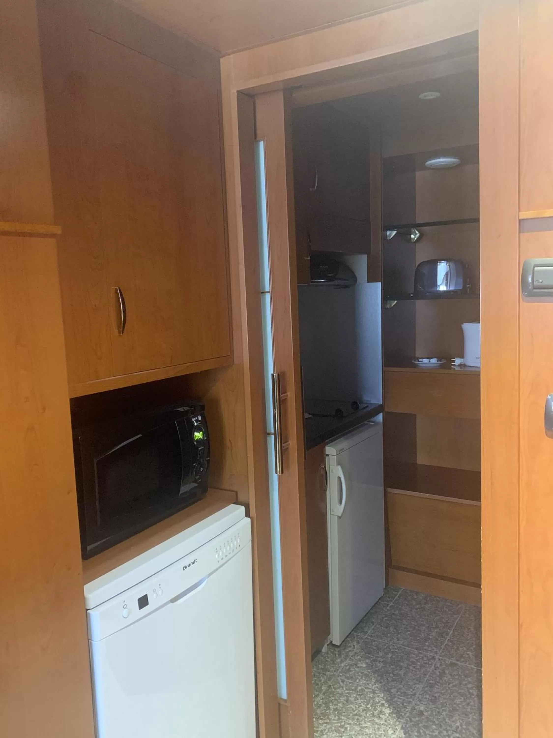 Kitchen or kitchenette in Goldstar Apartments & Suites