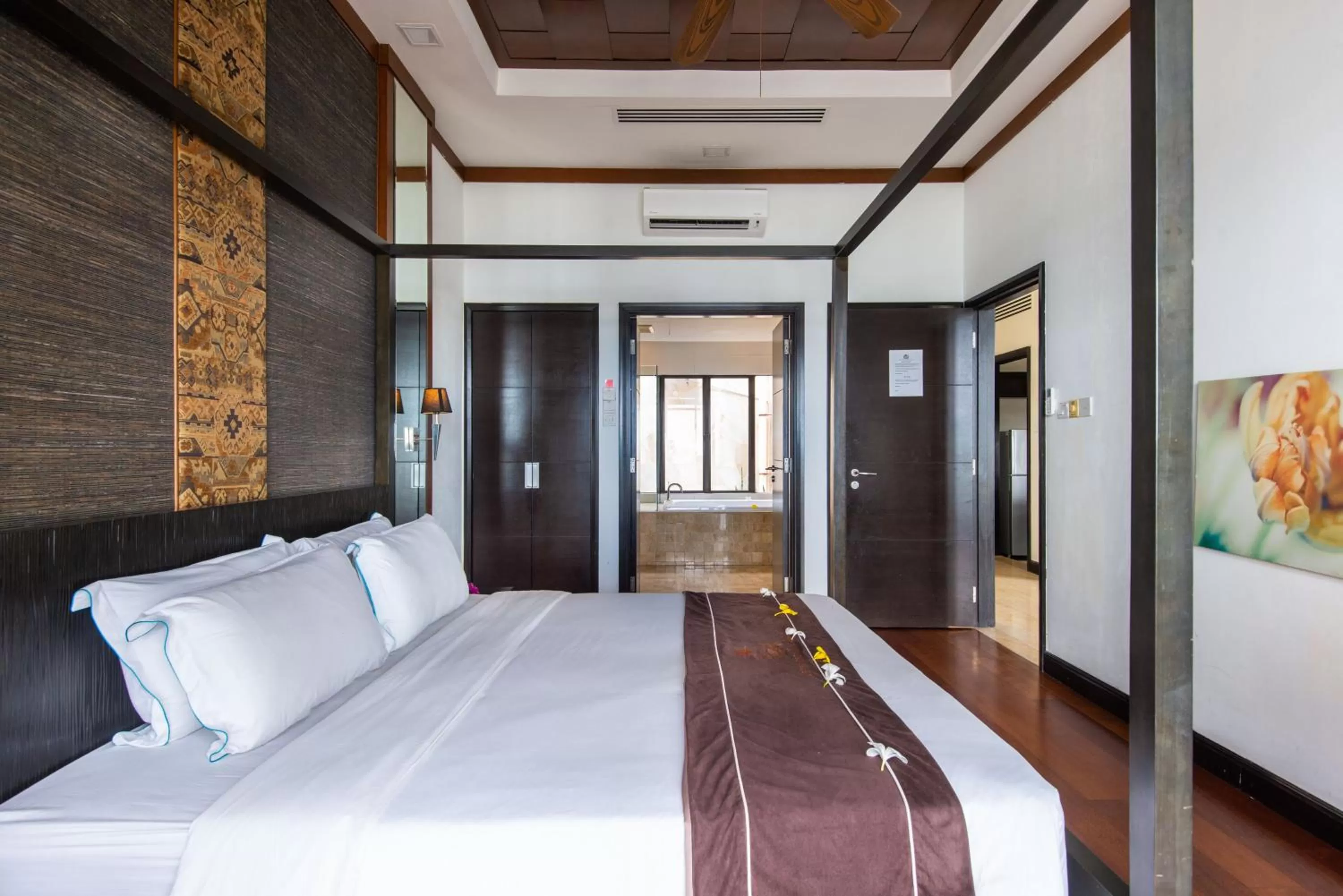 Bed in Sabah Beach Villas & Suites