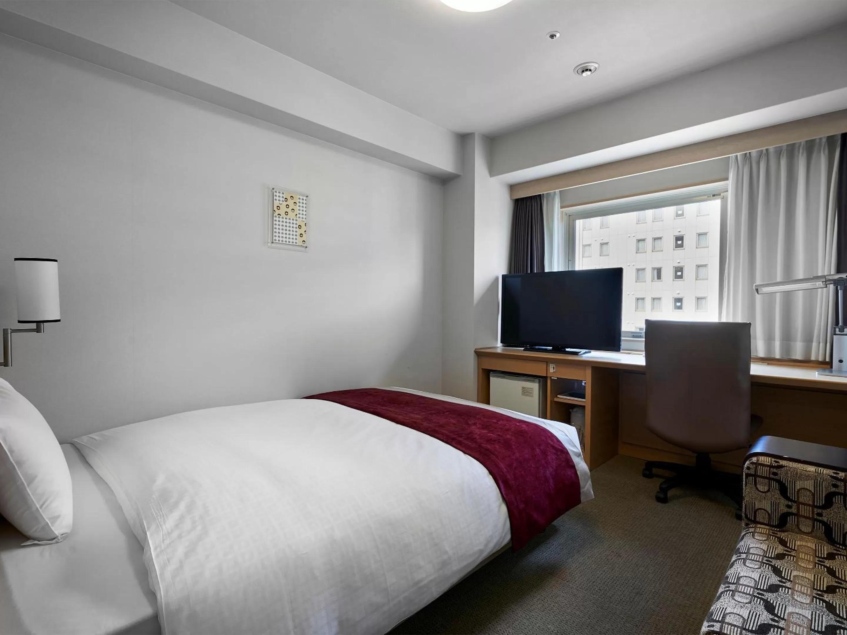 Photo of the whole room, Bed in Daiwa Roynet Hotel Hiroshima