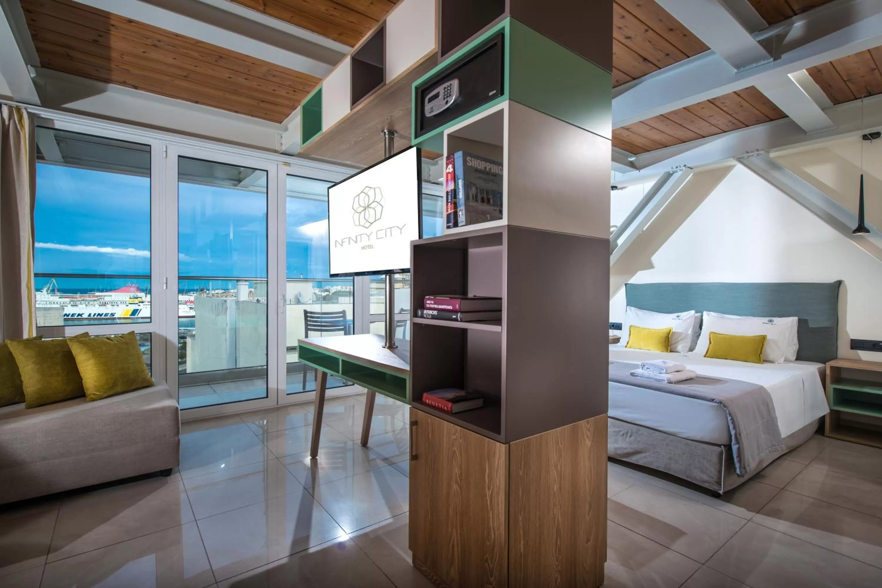 Seating area, Bed in Infinity City Boutique Hotel