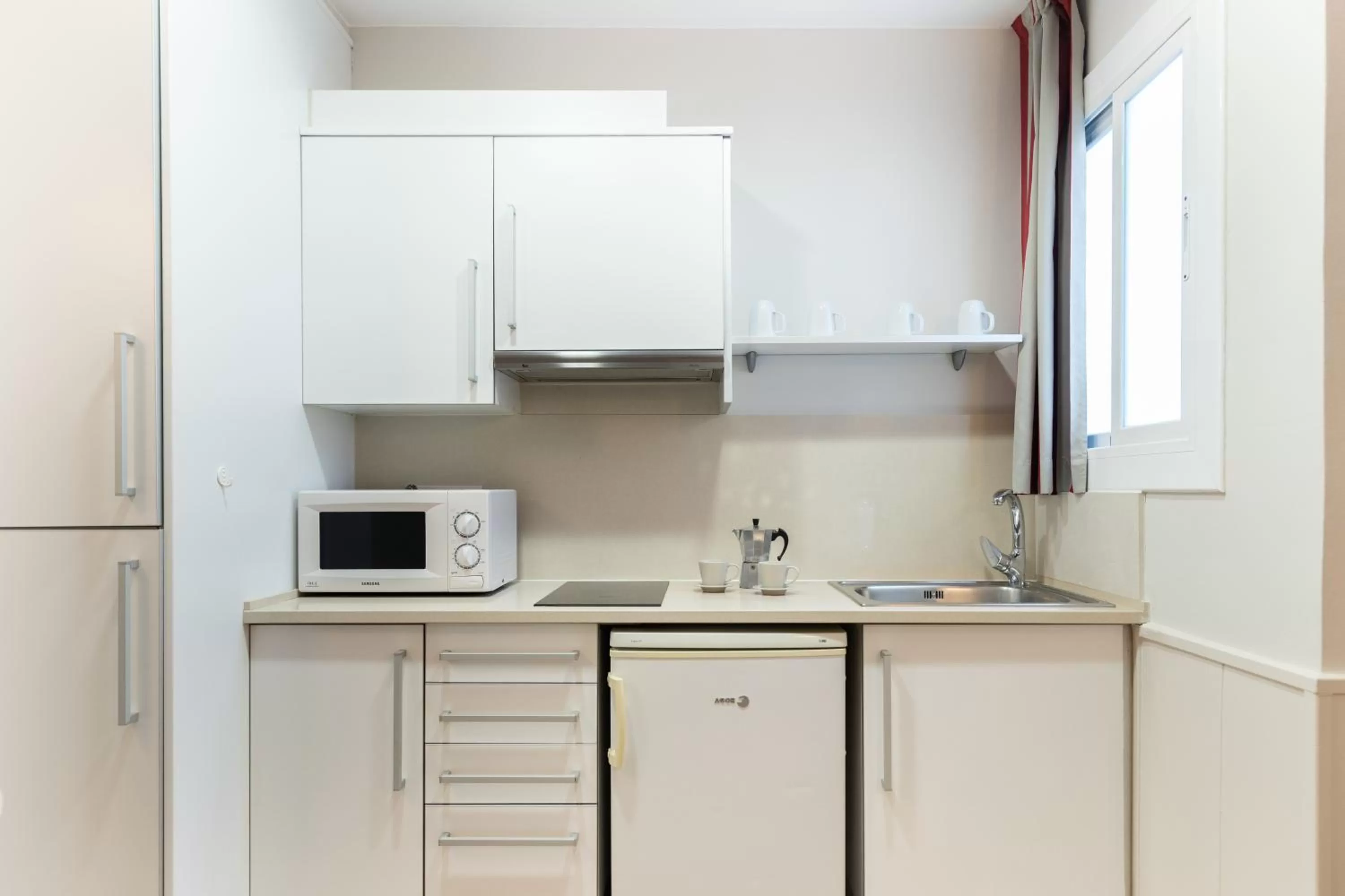 Kitchen or kitchenette in Atica Apartments - by Weflating