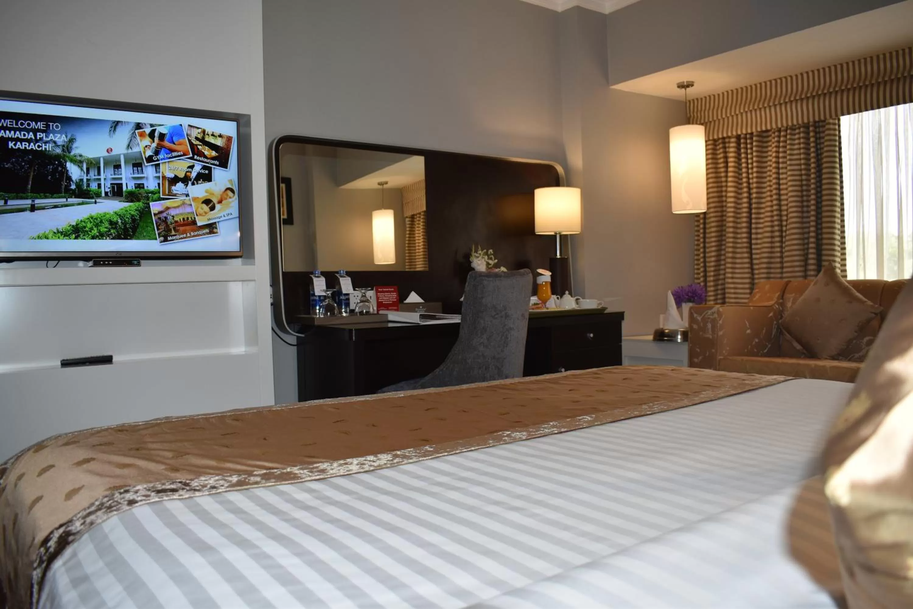 Bed in Ramada Plaza by Wyndham Karachi Airport Hotel