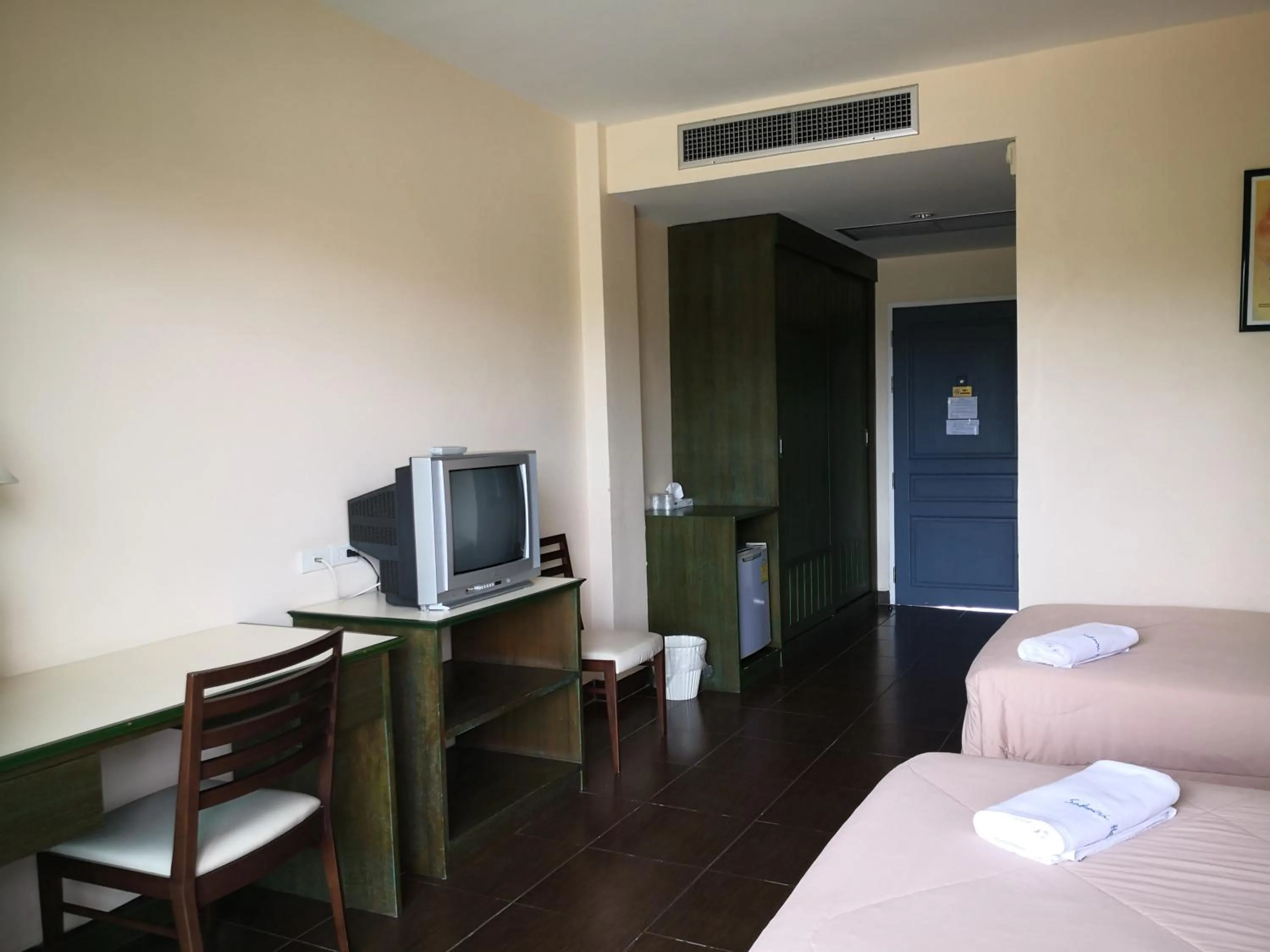 Bed in Baan Suksiri Hotel