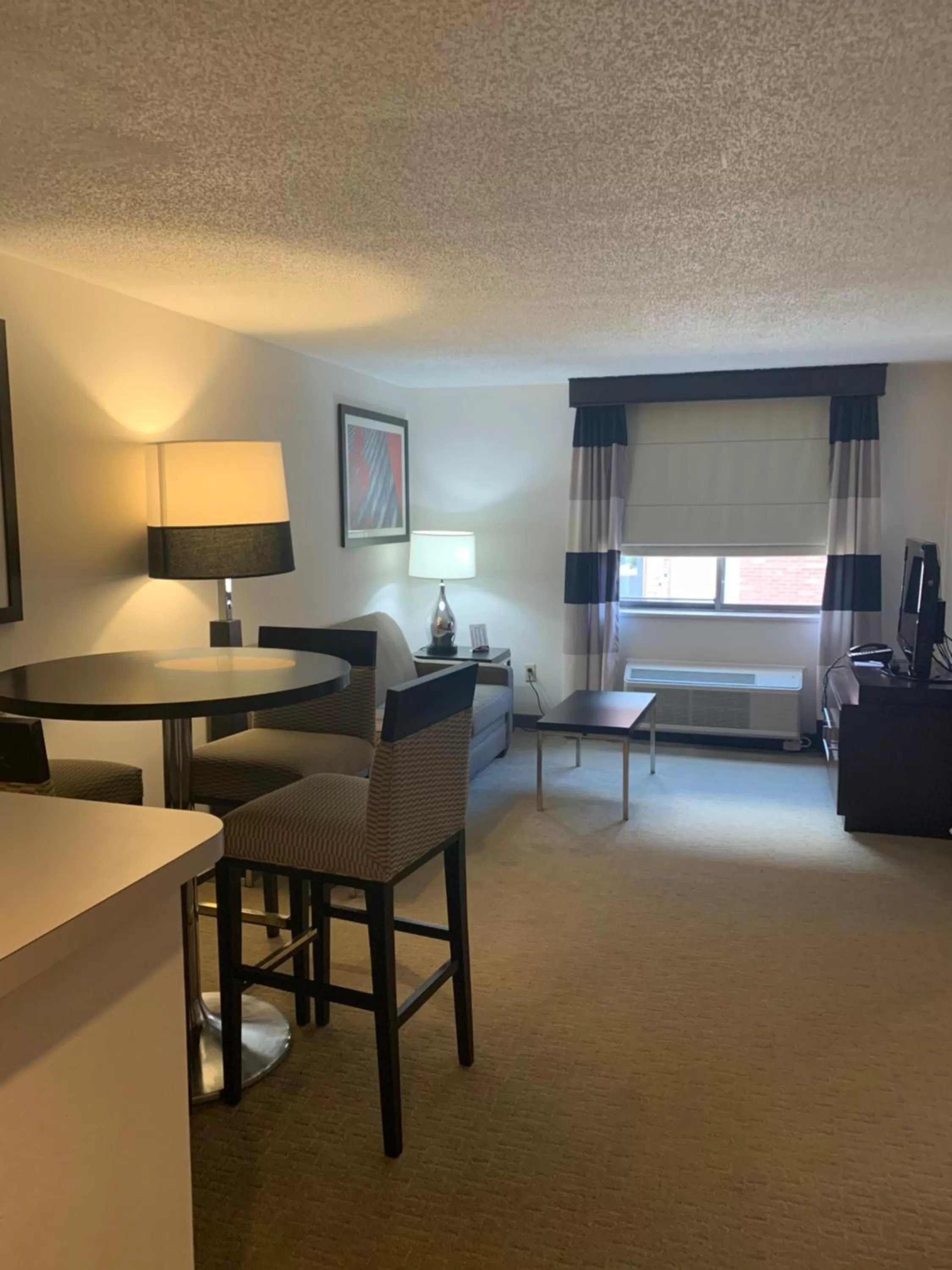 Living room in Ramada by Wyndham Marquette