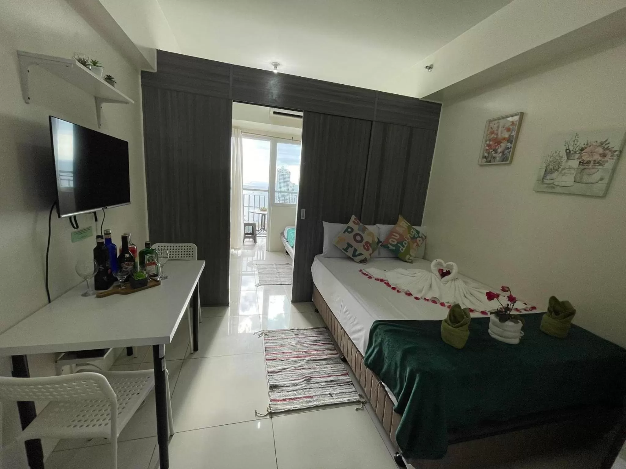 Bed in Green Residences Stays by PBYY