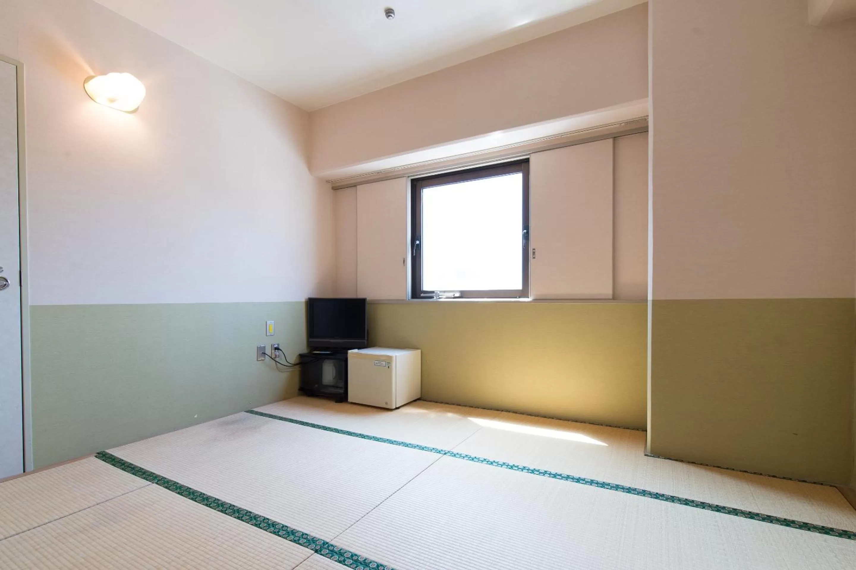 Photo of the whole room, Bed in Tabist Hotel Tetora Kitakyushu
