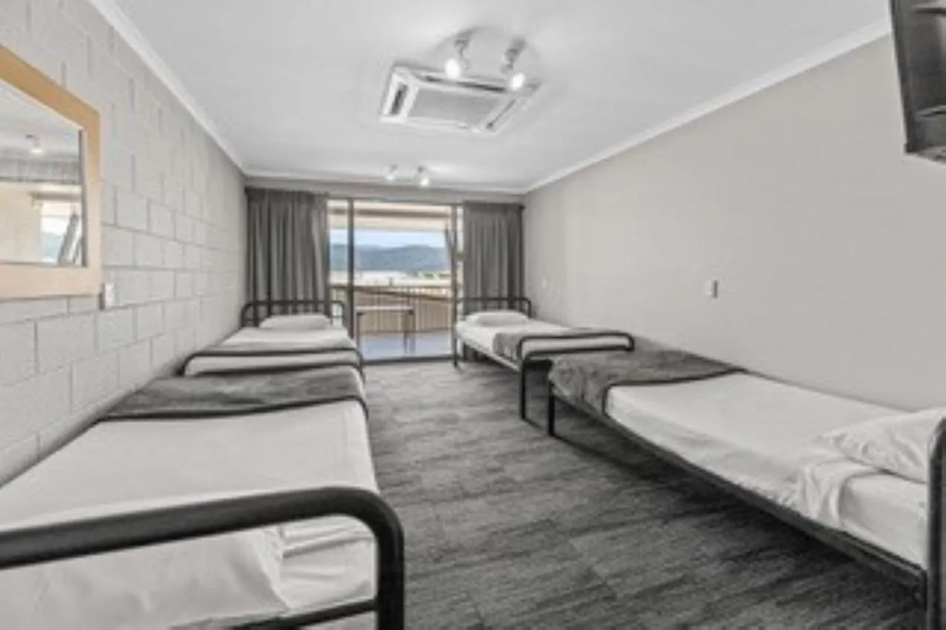 Bed in Gilligan's Hotel & Resort Cairns