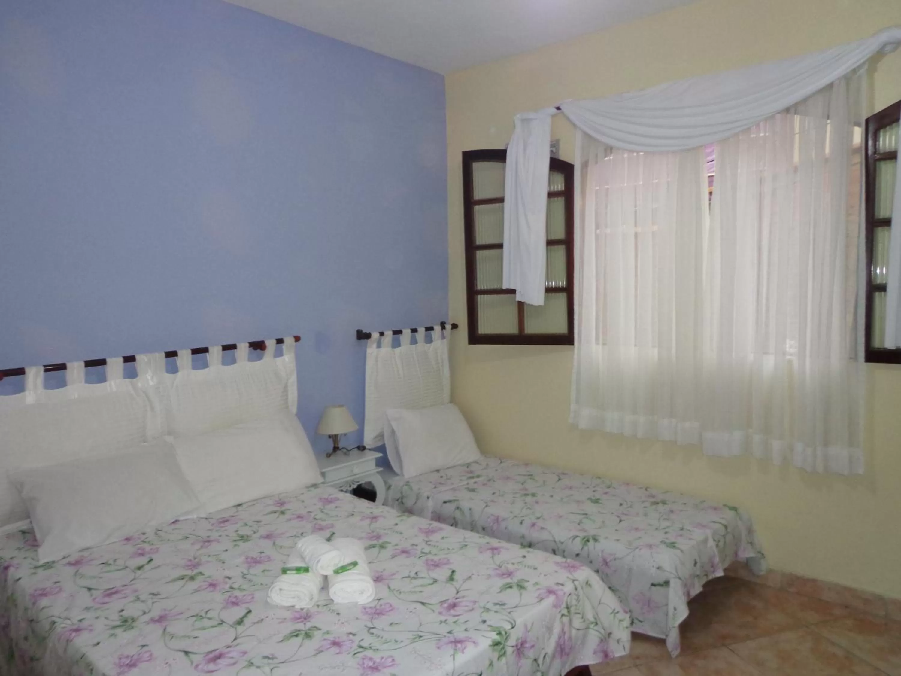 Bed in Pousada da Rose Paraty