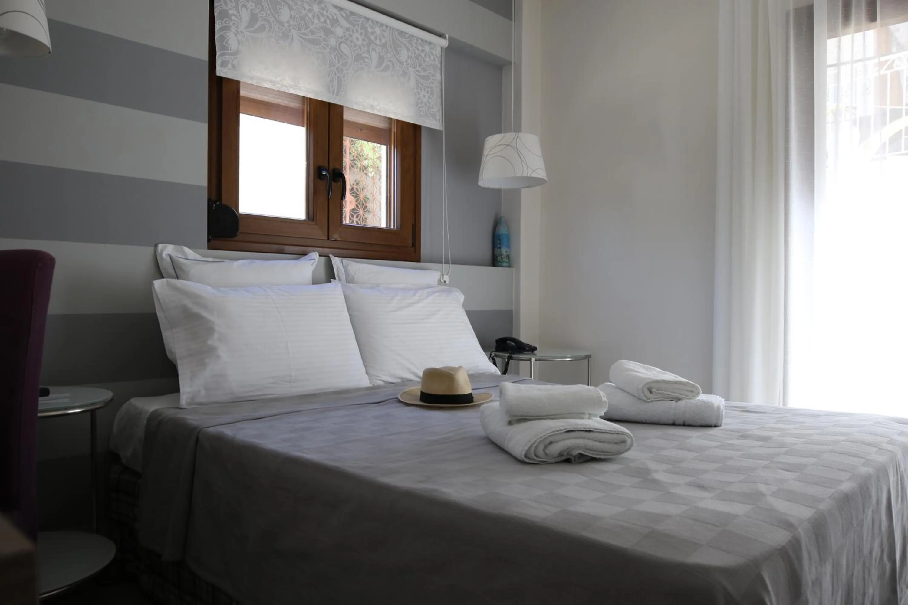 Bed in Dimitra Boutique Hotel