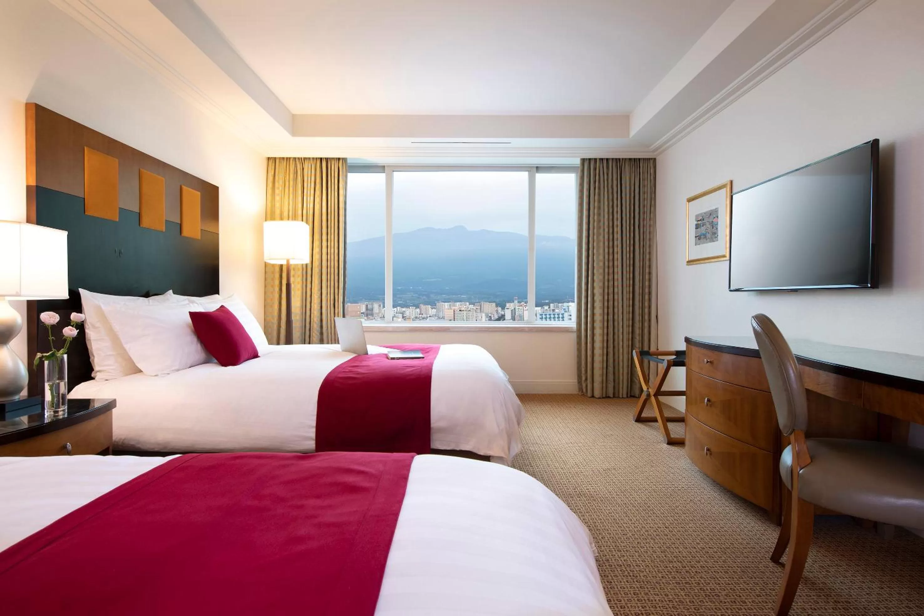 Bed in Ramada Plaza by Wyndham Jeju Ocean Front
