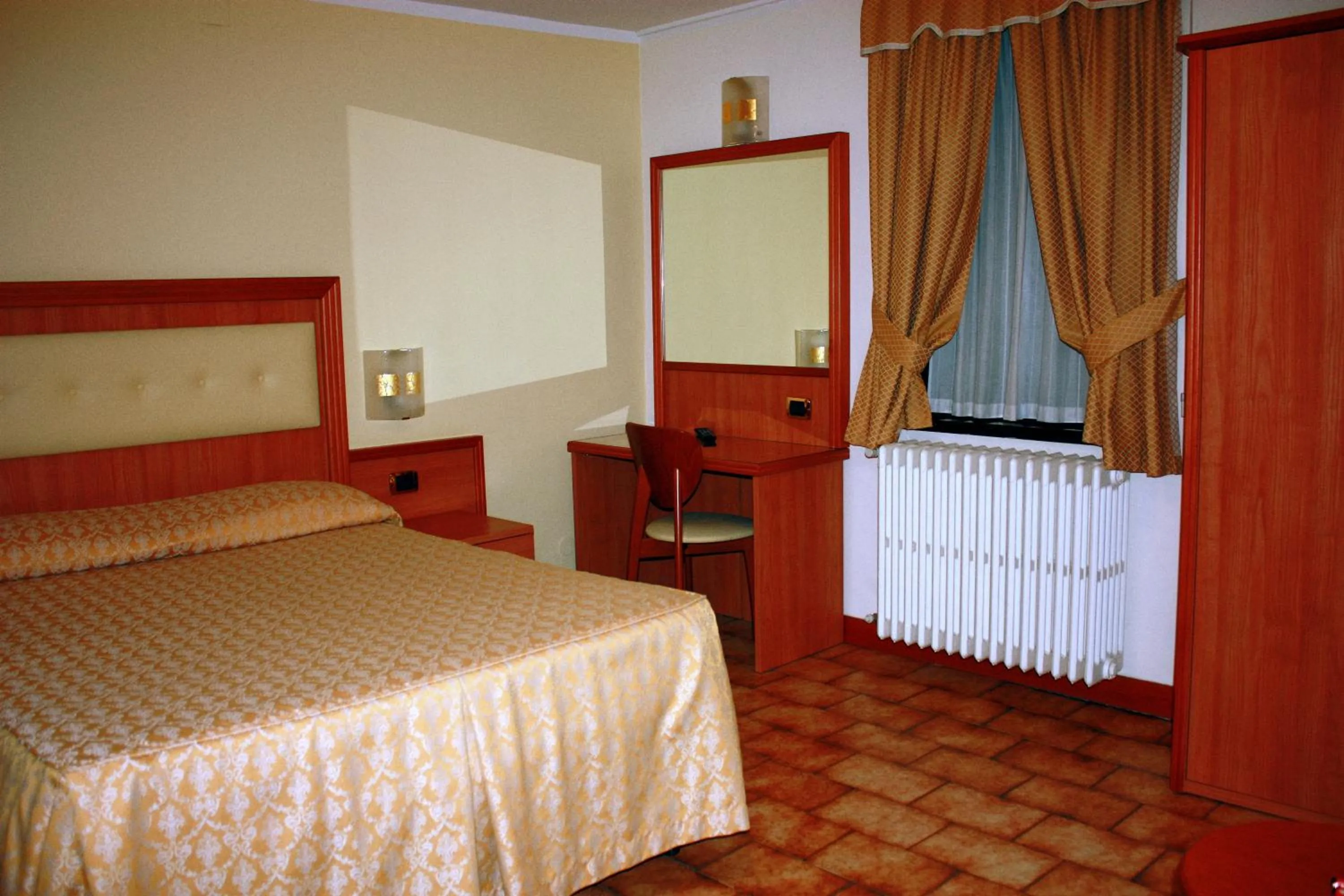 Bed in Piccolo Hotel