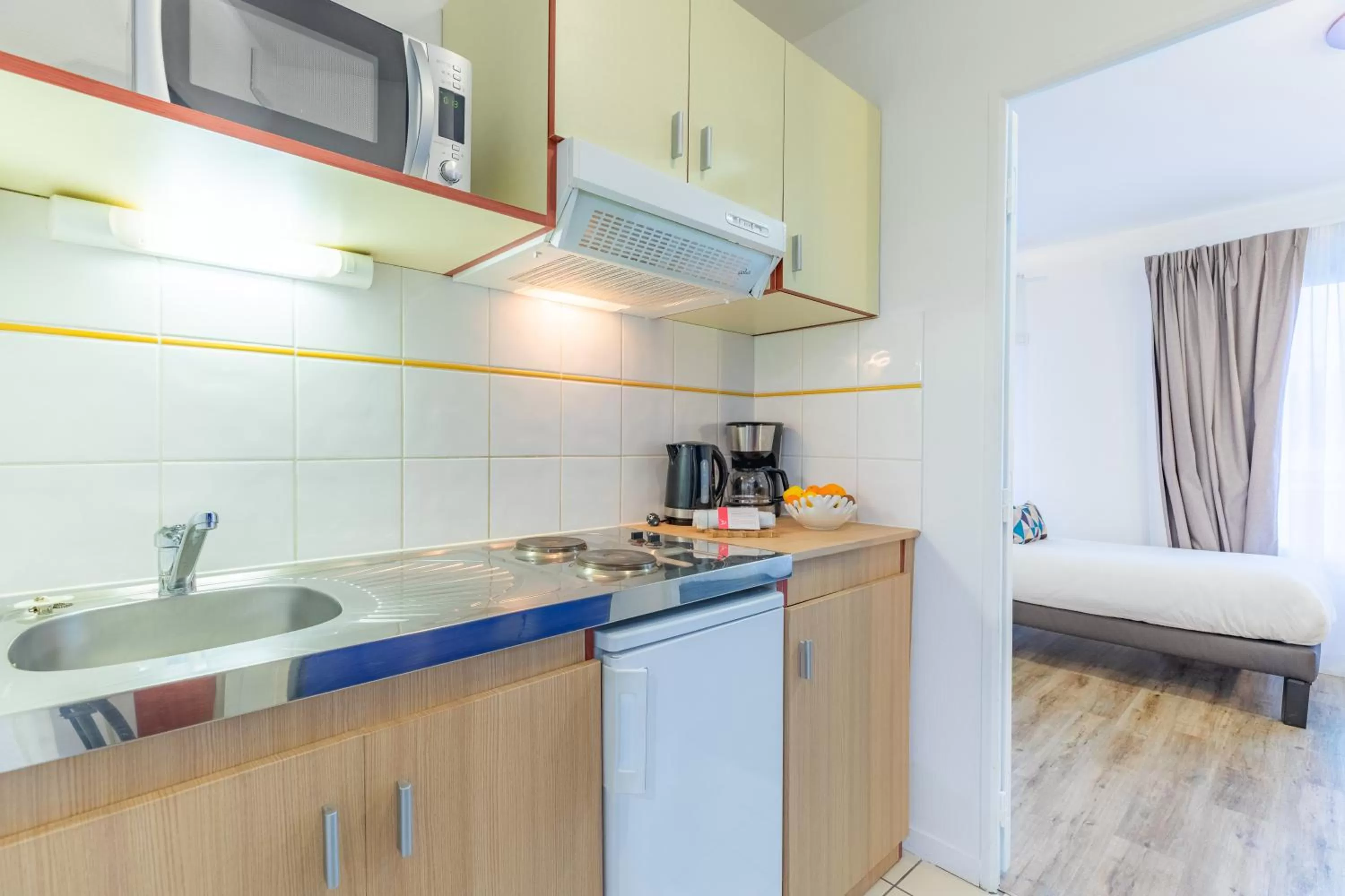 Kitchen or kitchenette in Appart'City Classic Caen