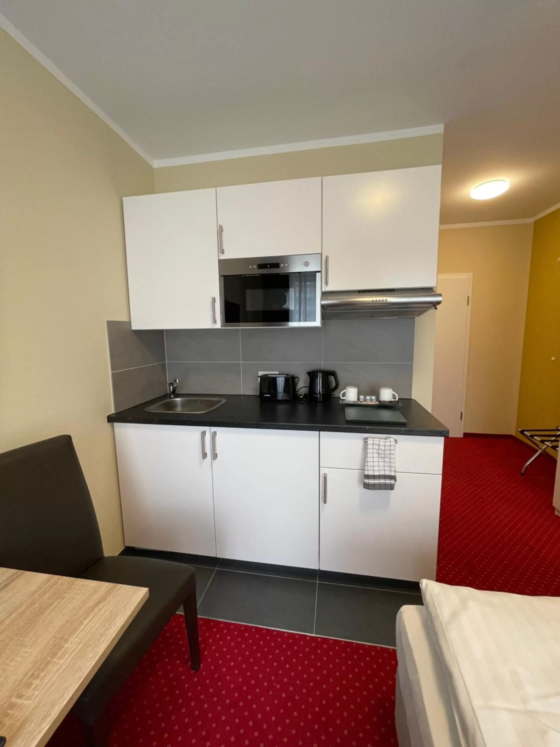 Kitchen or kitchenette in Palm Premium Hotel & Apartments