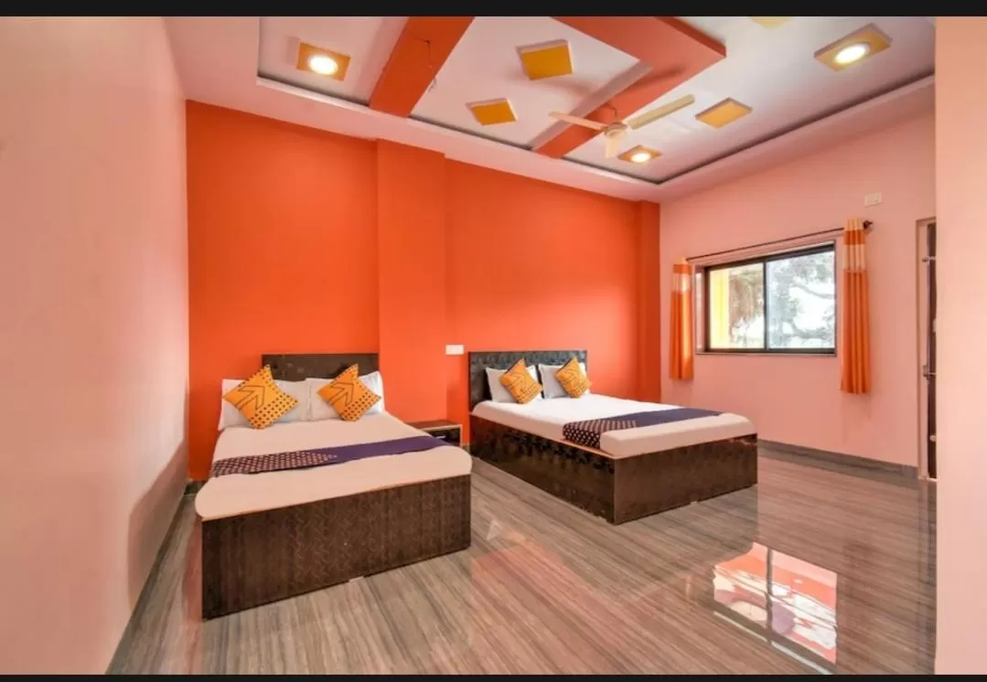 Bed in Hotel Nisarg Lodging And Restaurant