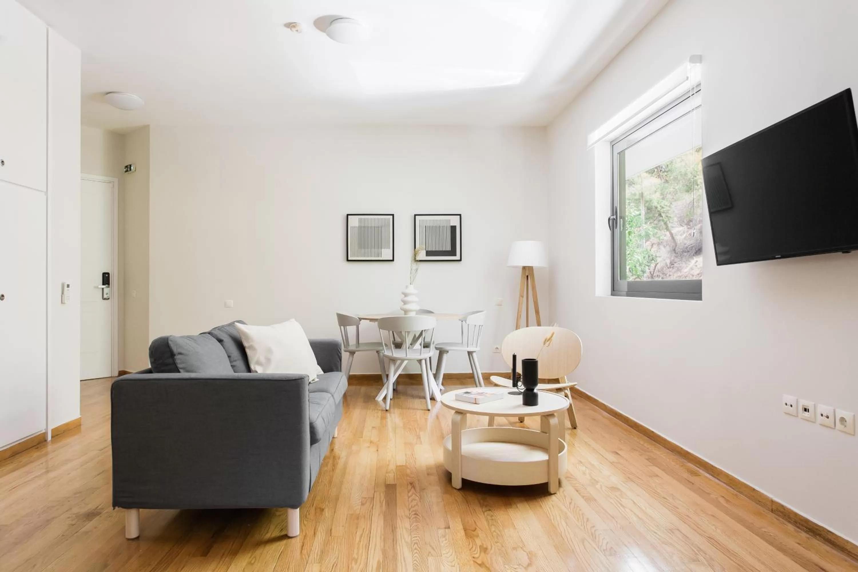 Living room, TV/Entertainment Center in ZOIA The Hill by UPSTREET