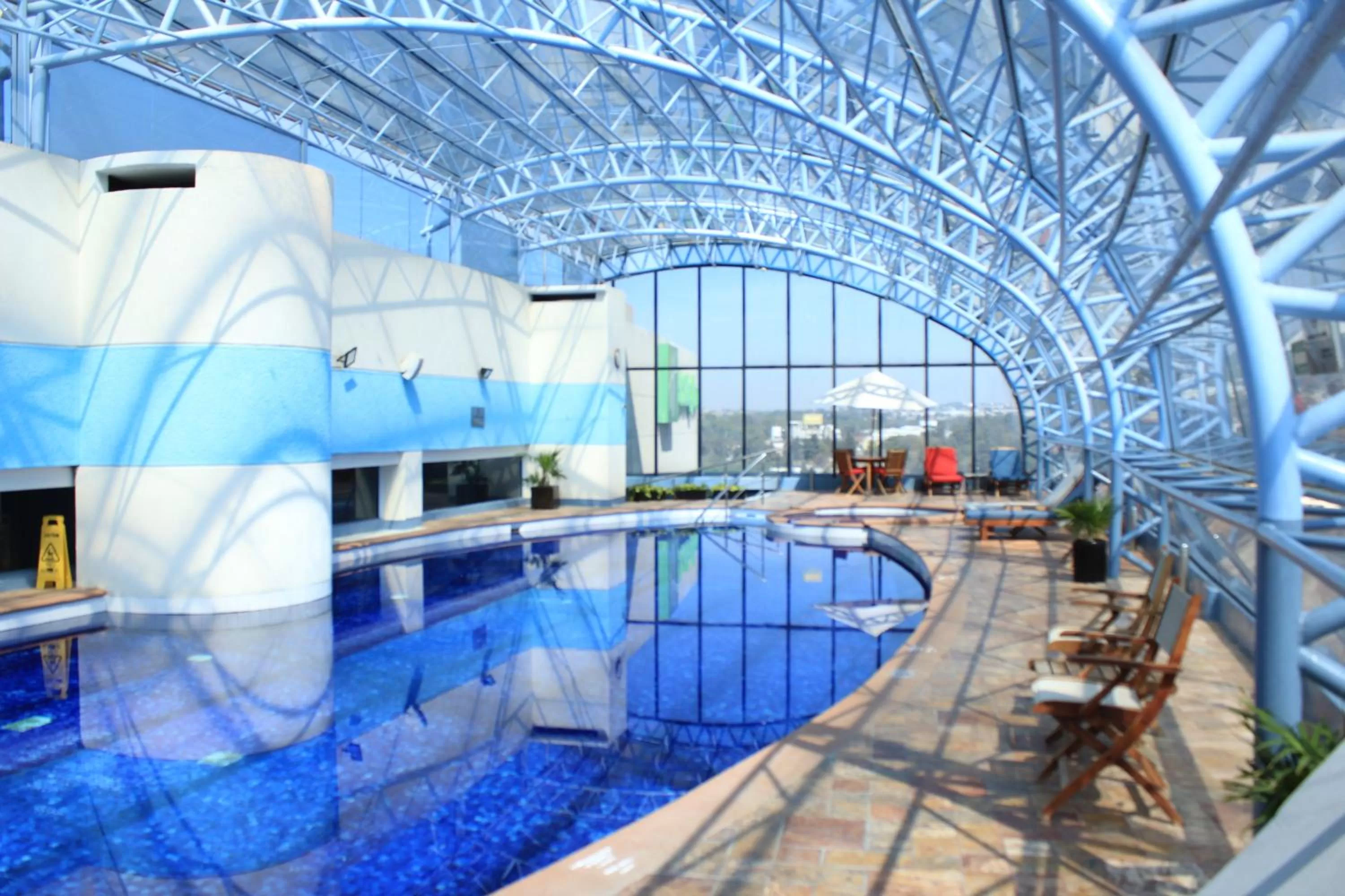 Swimming pool in Holiday Inn Puebla Finsa by IHG