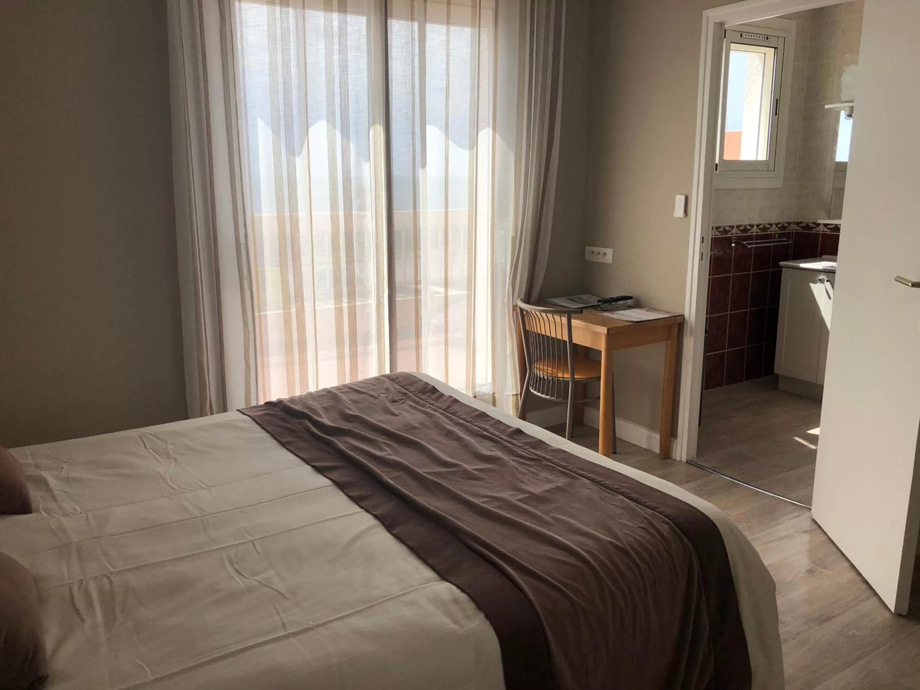 Bed in Logis Hotel Restaurant le Mirador