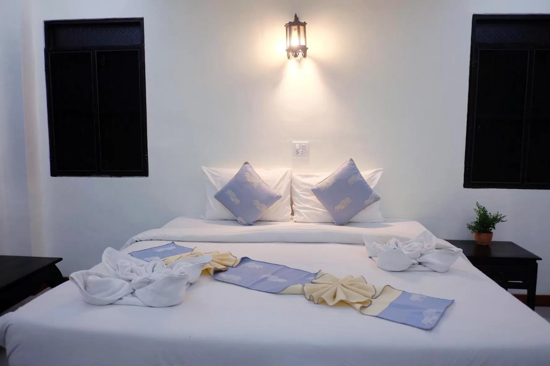 Bed in Rainforest Huahin Village Hotel