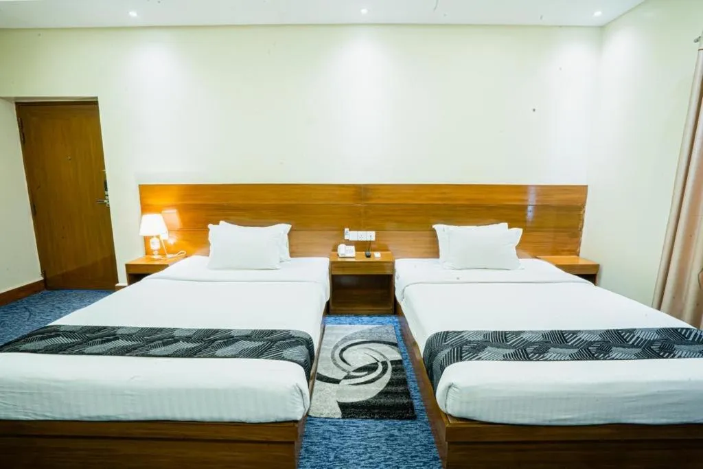 Bed in Richmond Hotel & Suites