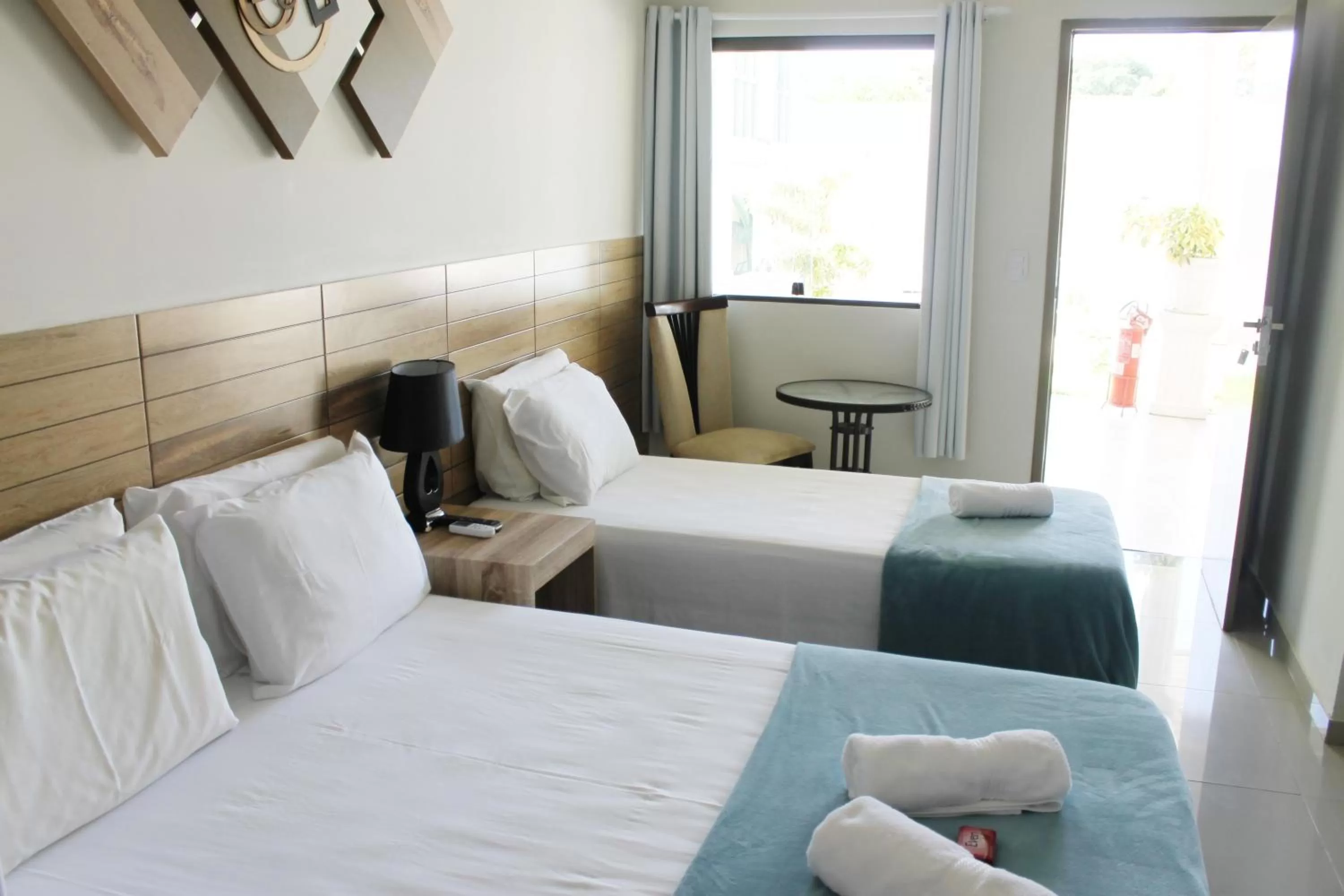 Bed in Pousada Das Palmeiras