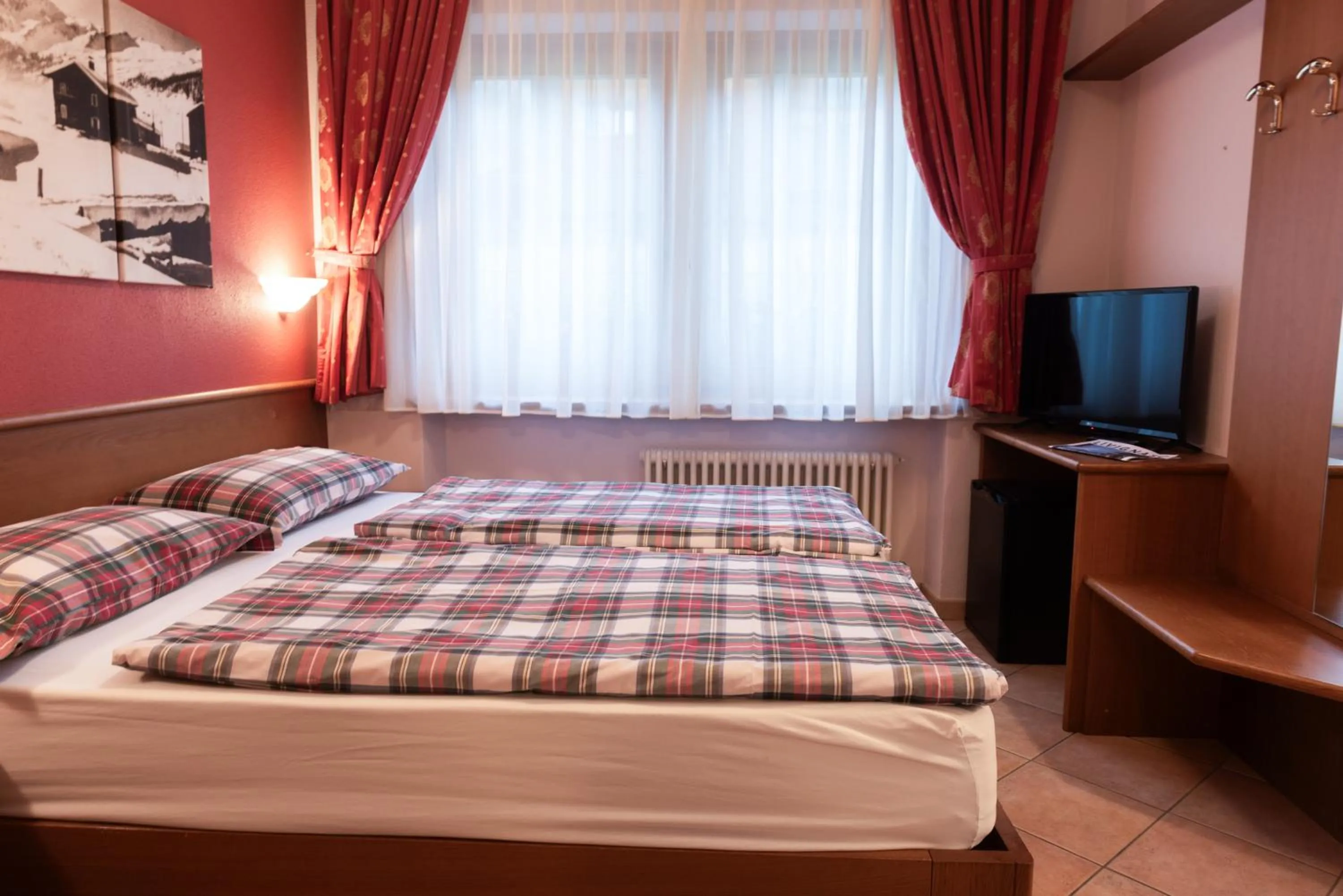 Bed in Hotel Garni Rin Da Rin