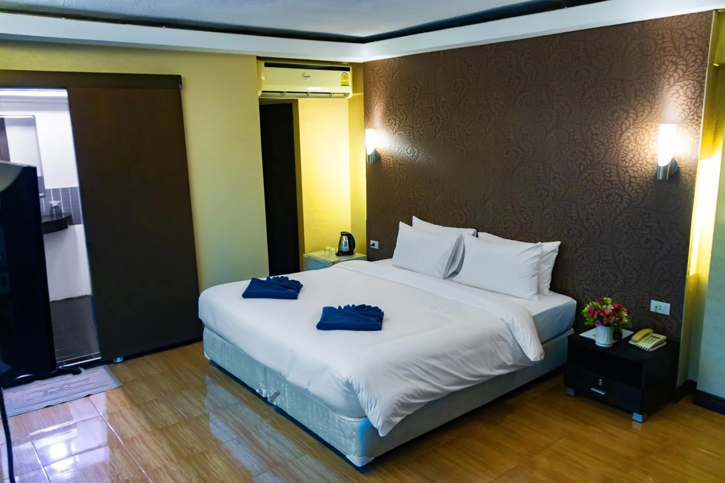 Bed in Visiting Card Hotel & Resort