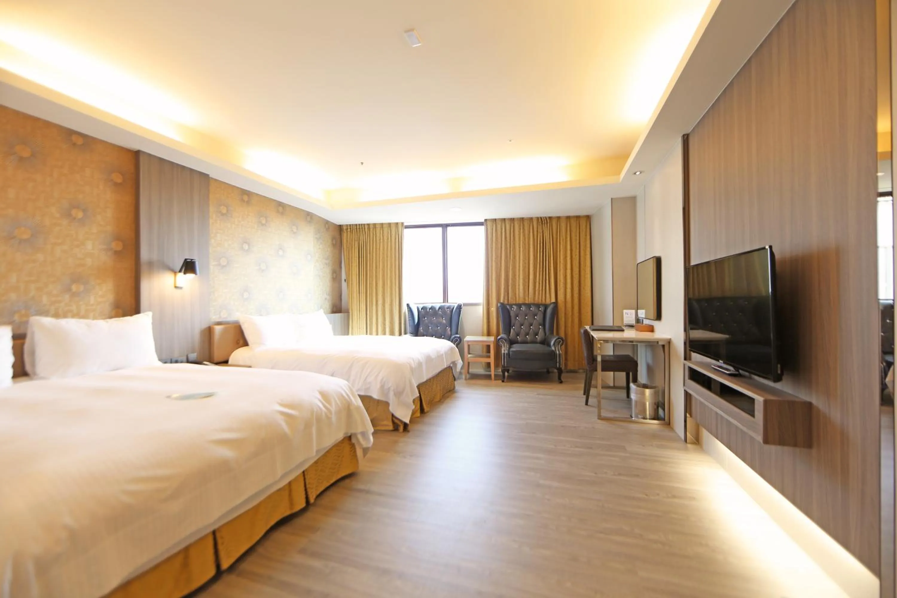 Bed in Grand Earl Hotel