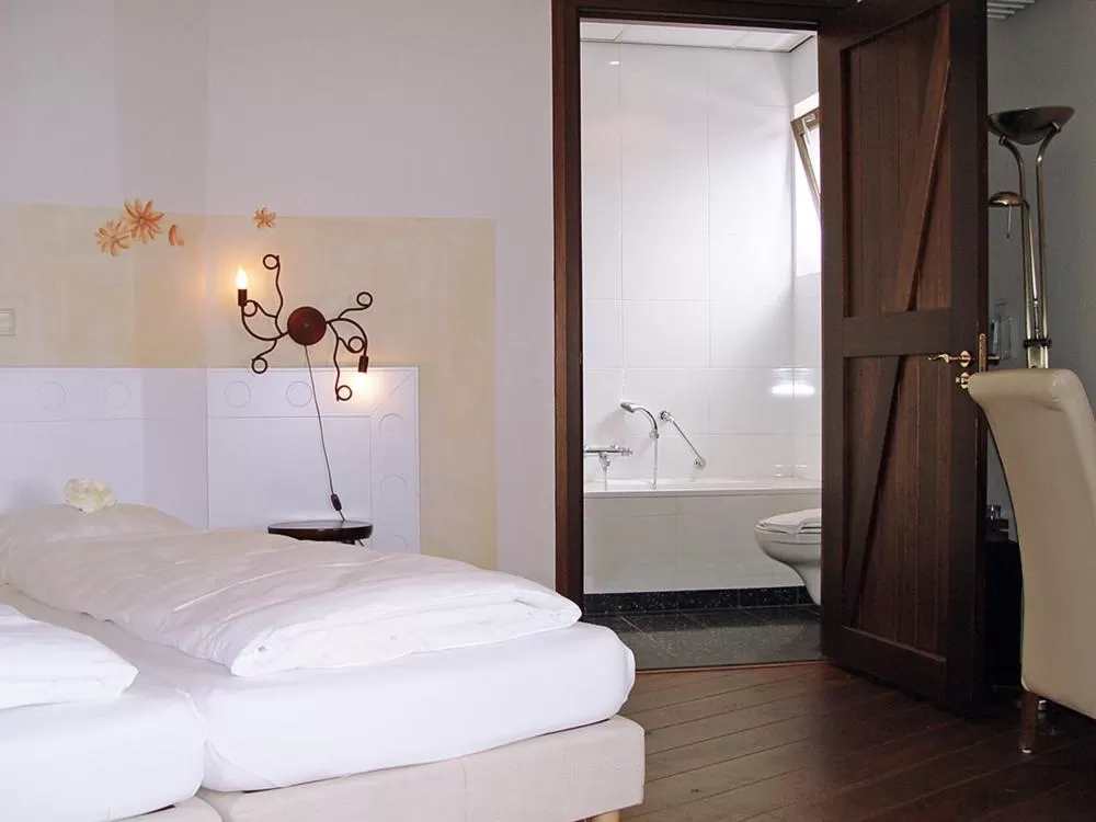 Bed in Hotel Huys van Heusden