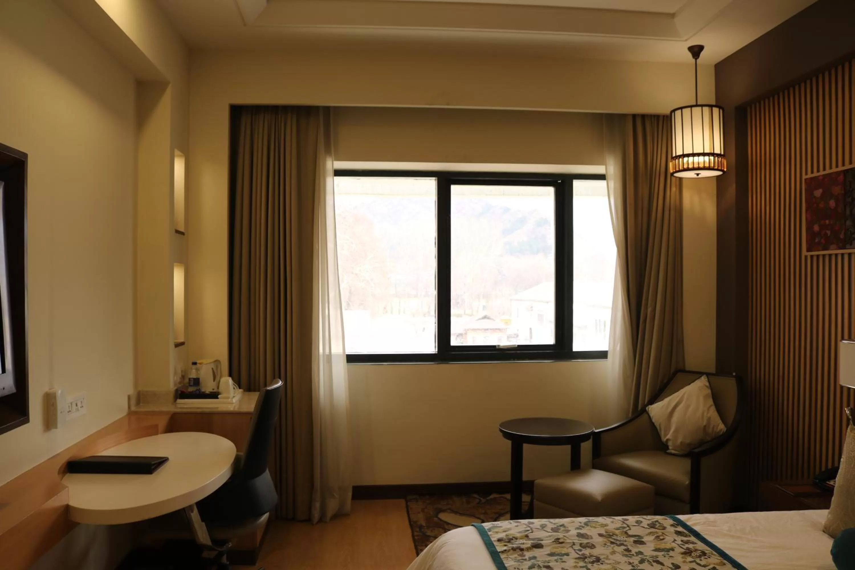 Seating area, Bed in Radisson Srinagar